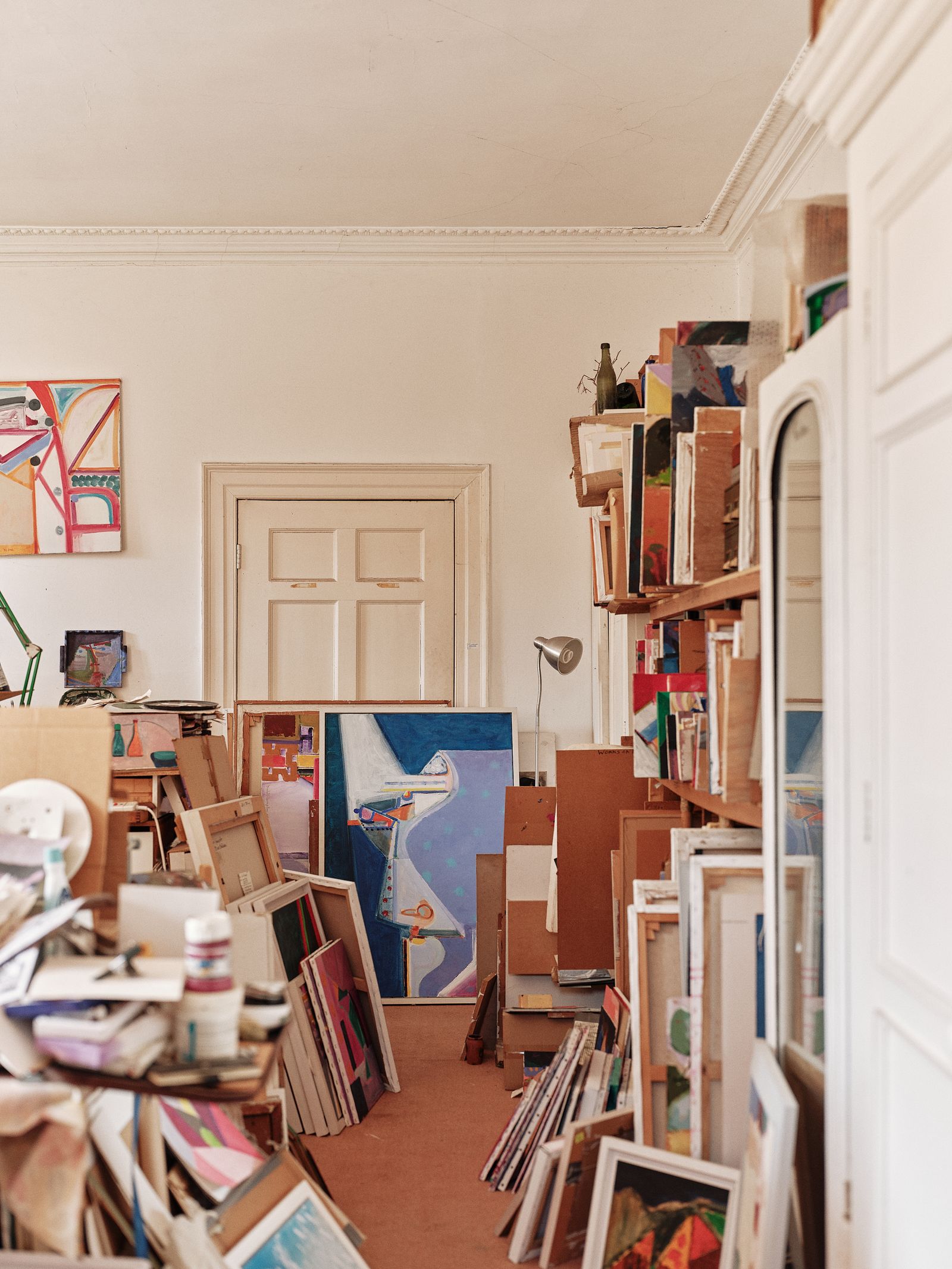 Image may contain Furniture Bookcase Lamp Indoors Interior Design Art and Painting