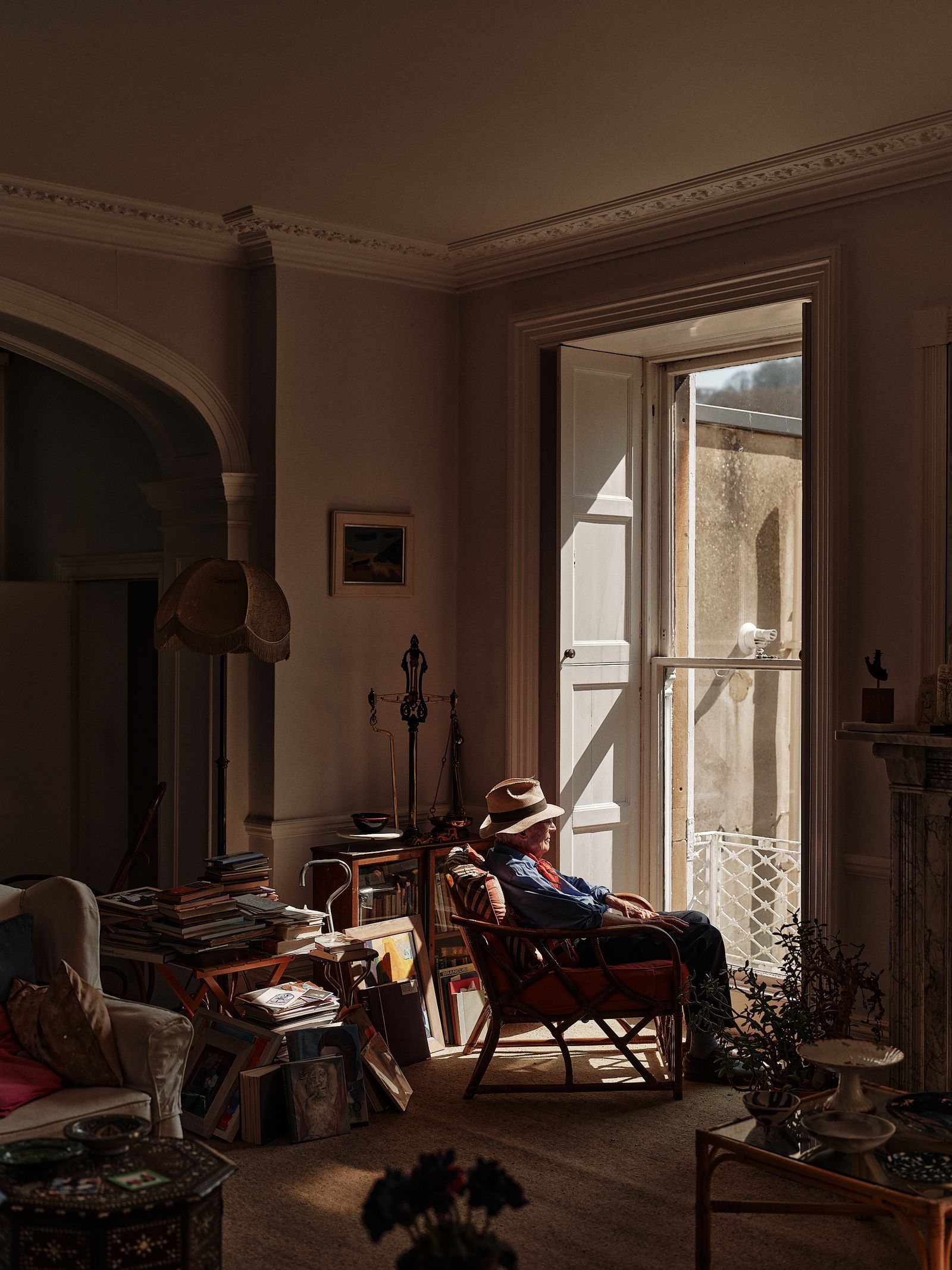 Image may contain Architecture Building Furniture Indoors Living Room Room Couch Chair Clothing Hat and Adult