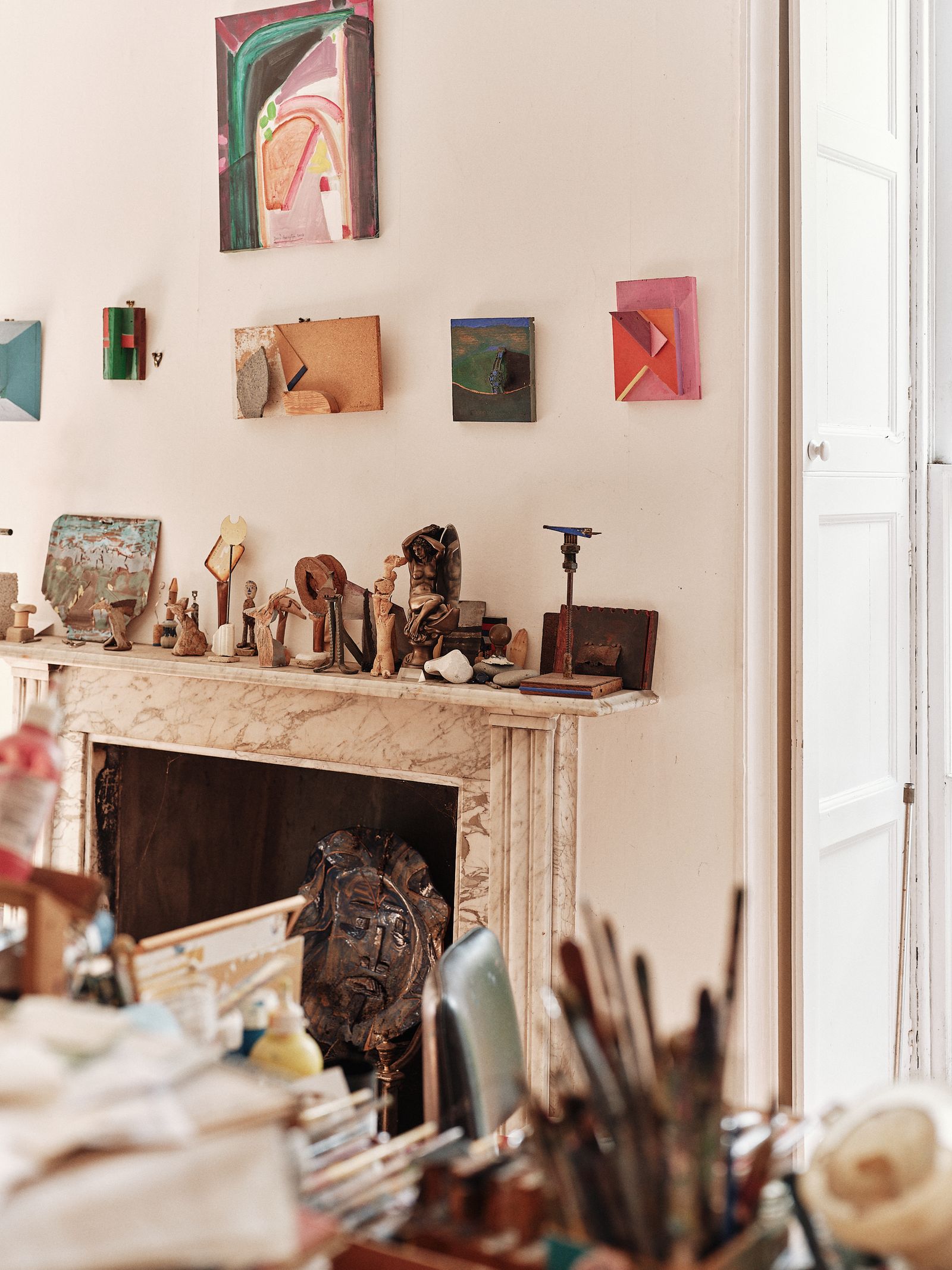 Image may contain Indoors Interior Design Wood Person Furniture Table and Fireplace