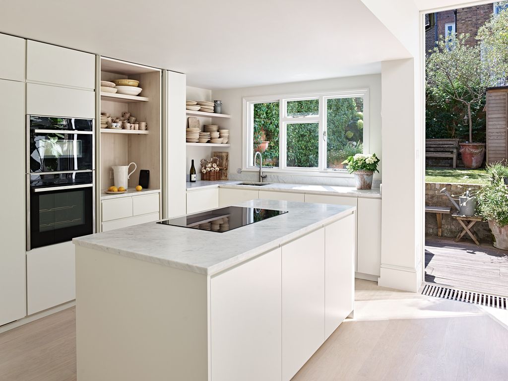 Image may contain Indoors Interior Design Kitchen Plant Bench Furniture and Kitchen Island