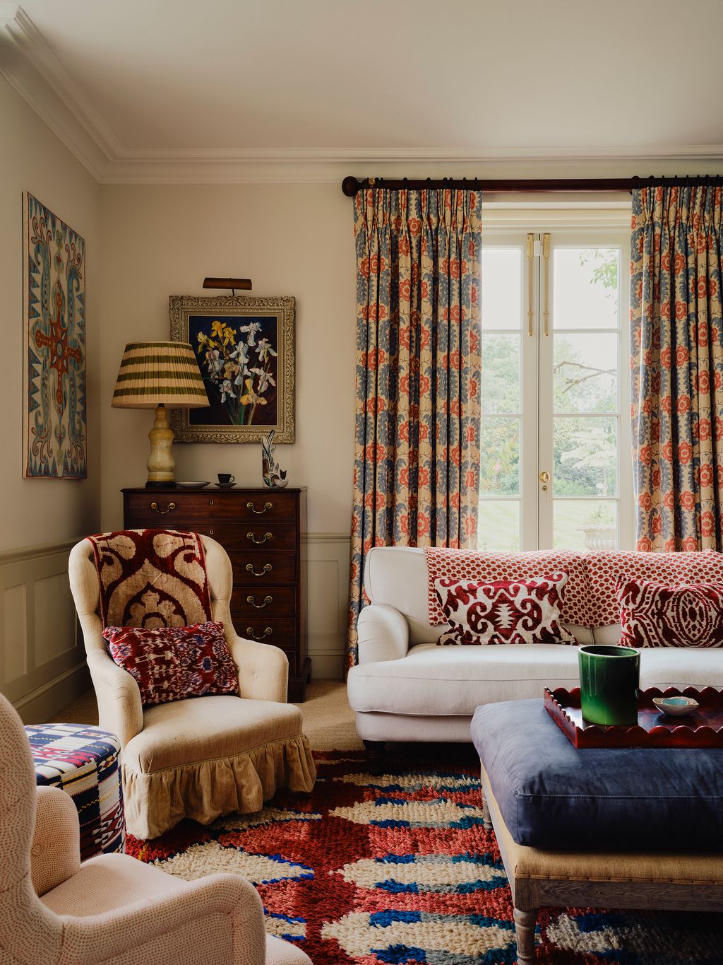 Image may contain Lamp Home Decor Couch Furniture Cup Art Painting Architecture Building Indoors and Living Room