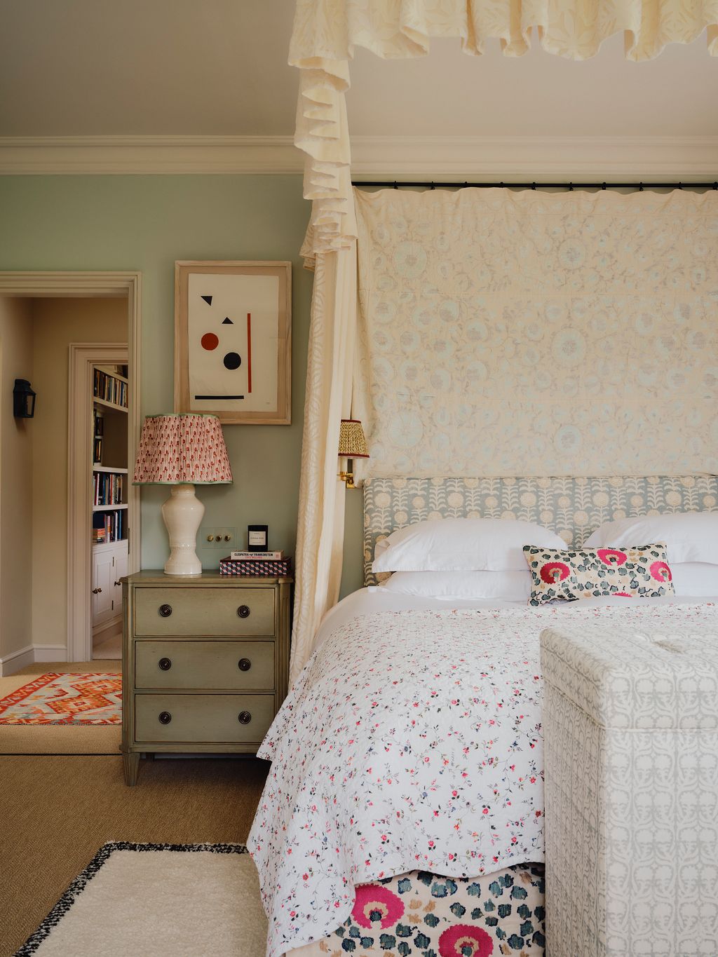 Image may contain Lamp Furniture Bed Bedroom Indoors Room Home Decor Rug Art and Painting