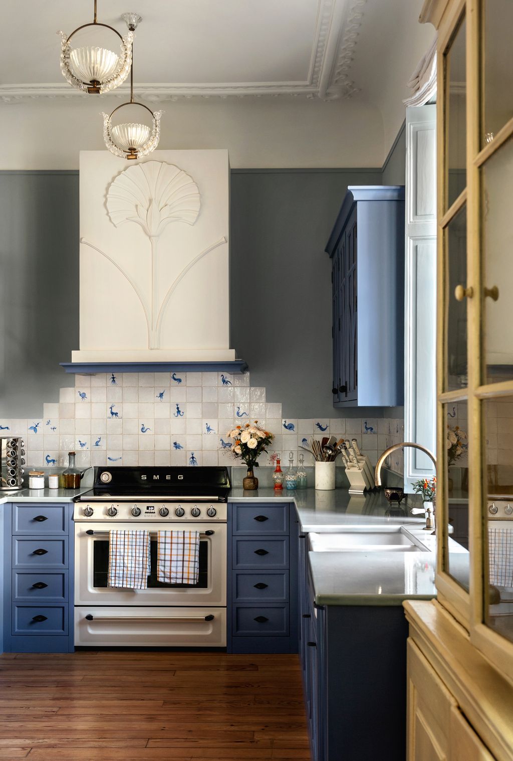 Image may contain Indoors Interior Design Kitchen Cup Sink Sink Faucet Cooktop Lamp Appliance and Device