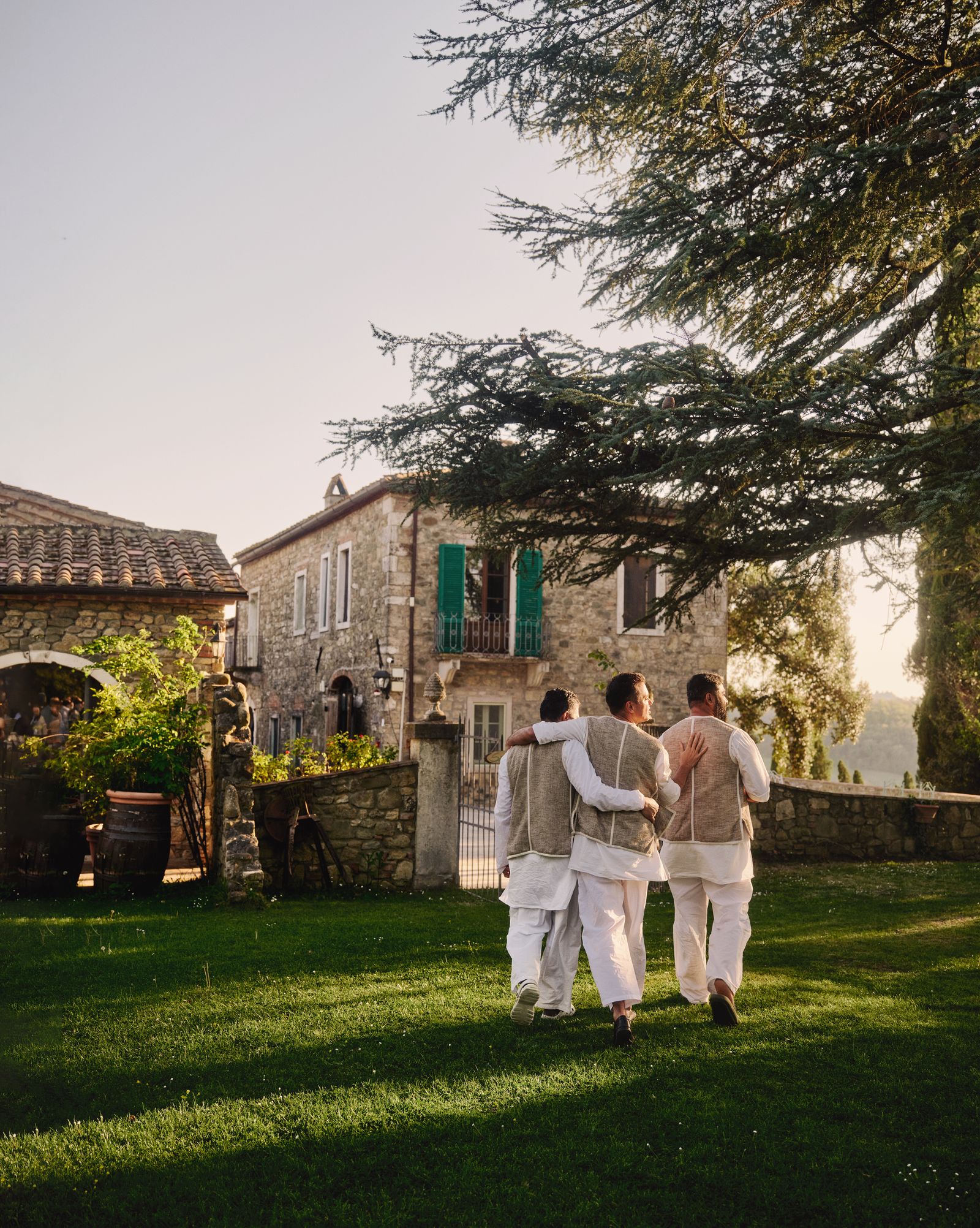 Image may contain Grass Plant Architecture Building House Housing Villa Clothing Footwear Shoe Lawn and Adult