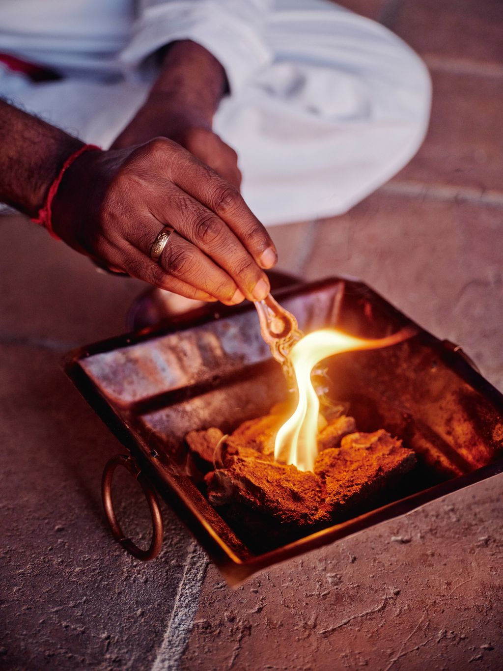 Image may contain Food Food Presentation Accessories Jewelry Ring Adult Person Bread Cooking and Pouring Food
