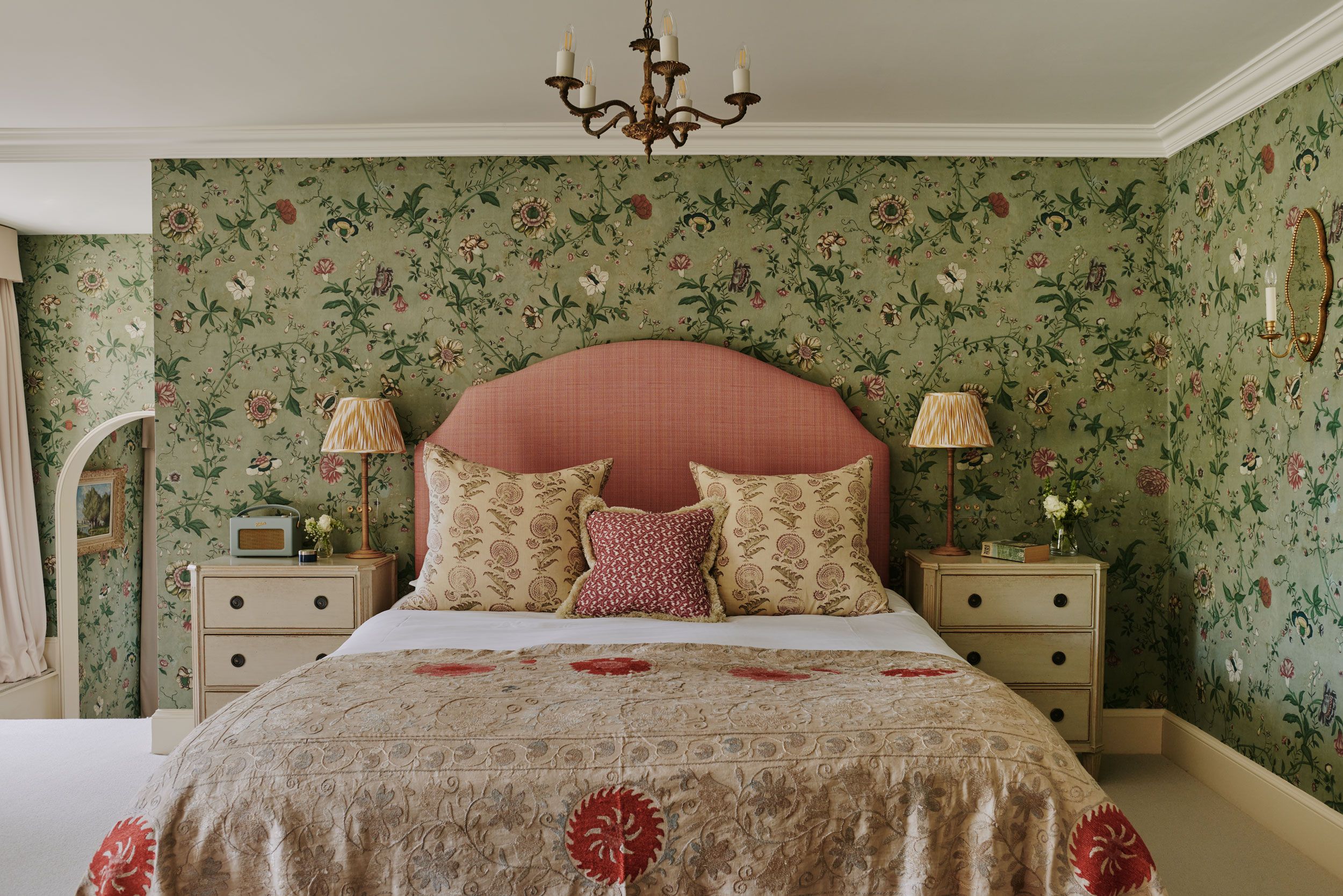 Image may contain: Lamp, Home Decor, Cushion, Bed, Furniture, Chandelier, Art, Painting, Candle, Pillow, Bedroom, and Indoors