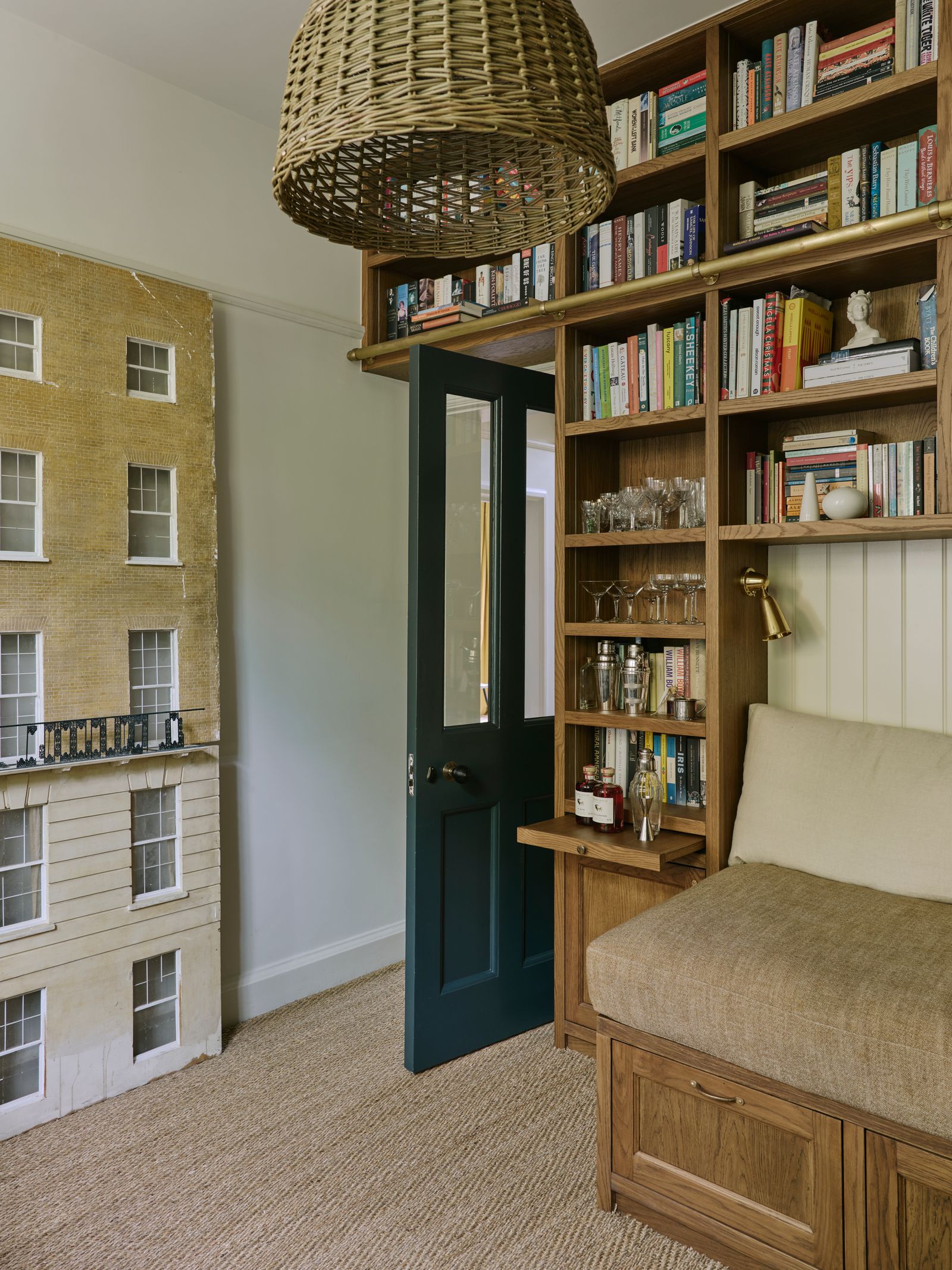 Image may contain Furniture Bookcase Lamp Indoors Interior Design Person and Couch