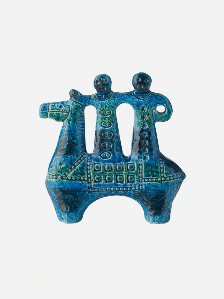 Image may contain: Bronze, Person, and Turquoise