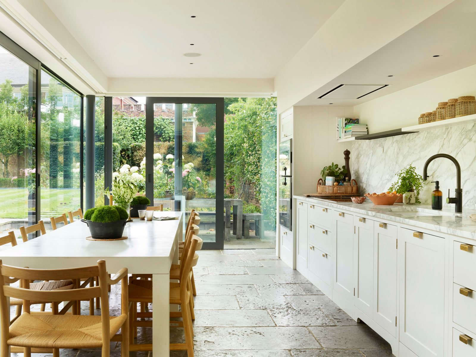 Image may contain Indoors Interior Design Architecture Building Dining Room Dining Table Furniture Room and Table