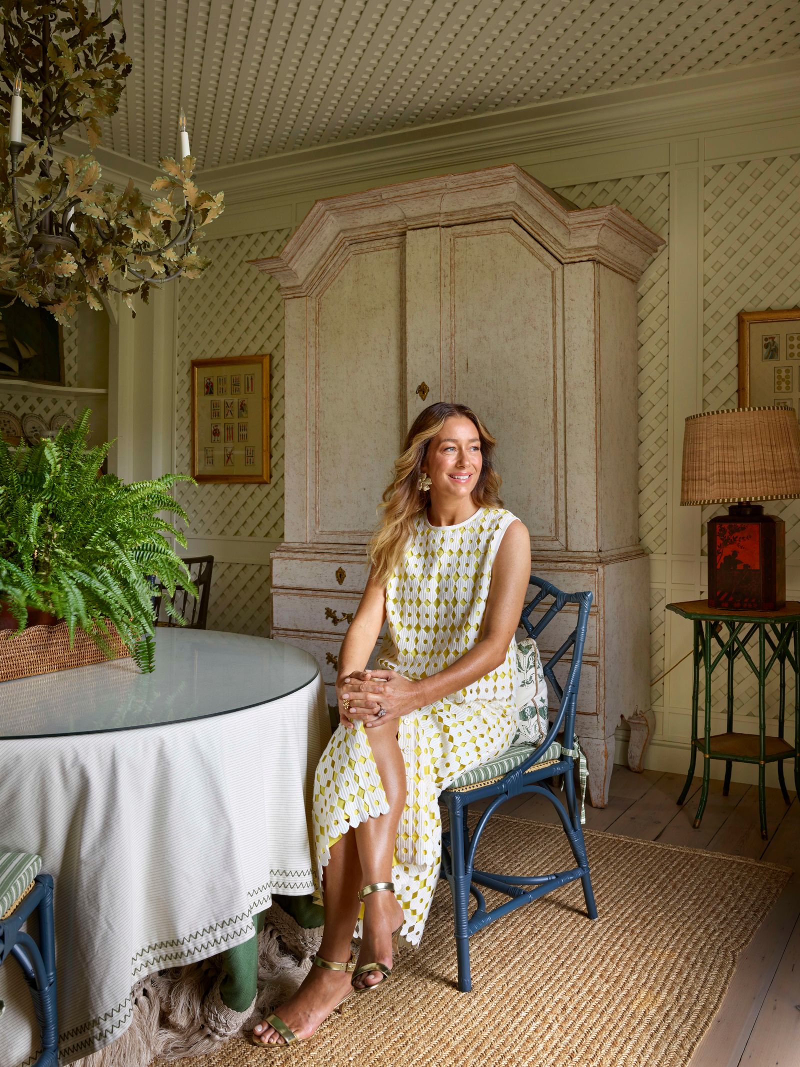 Image may contain Gracia Querejeta Person Sitting Lamp Desk Furniture Table Adult Chair Art Painting and Plant