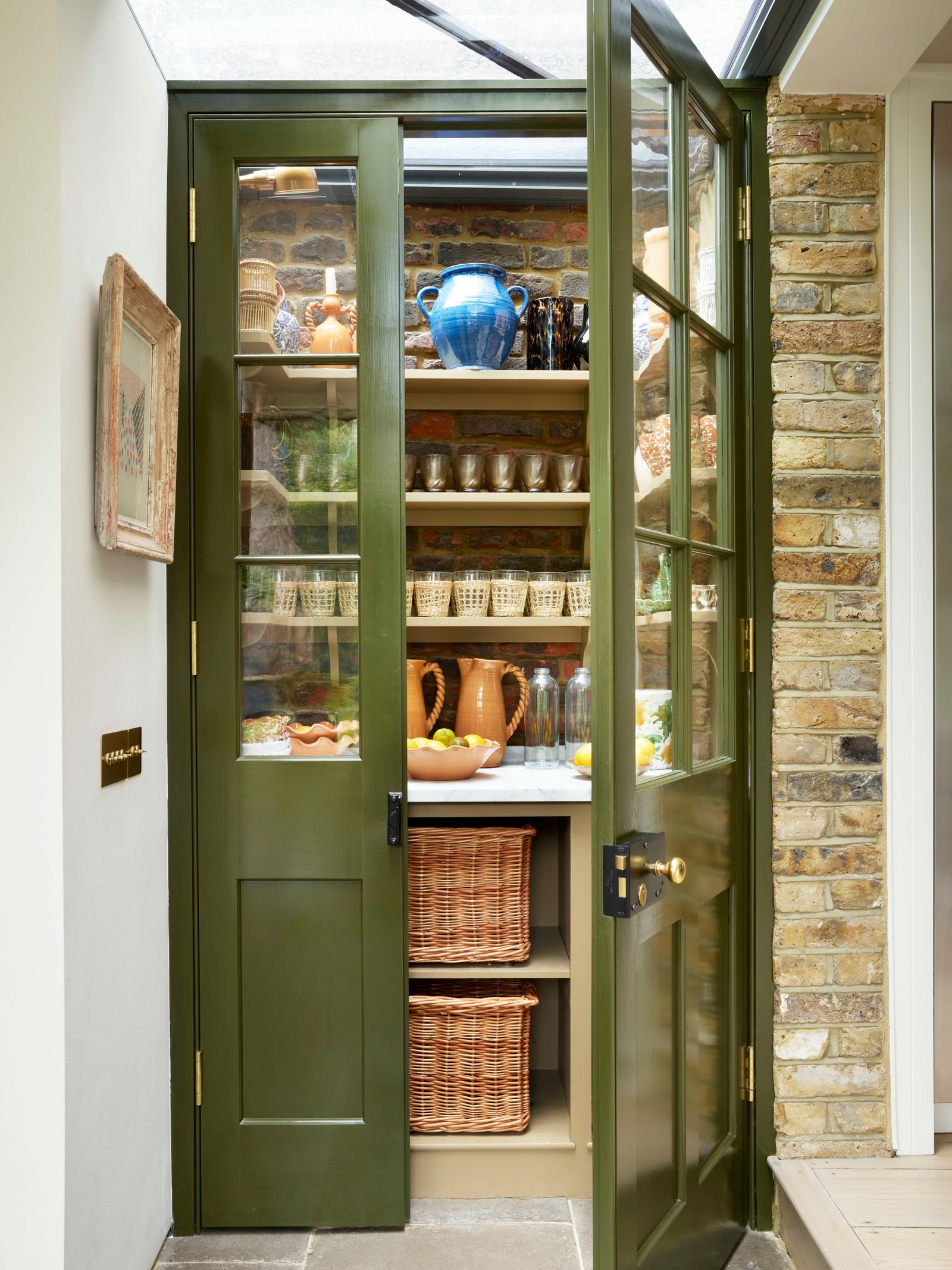 Image may contain Shelf Door Pantry Art Painting Architecture Building Housing Indoors and Interior Design