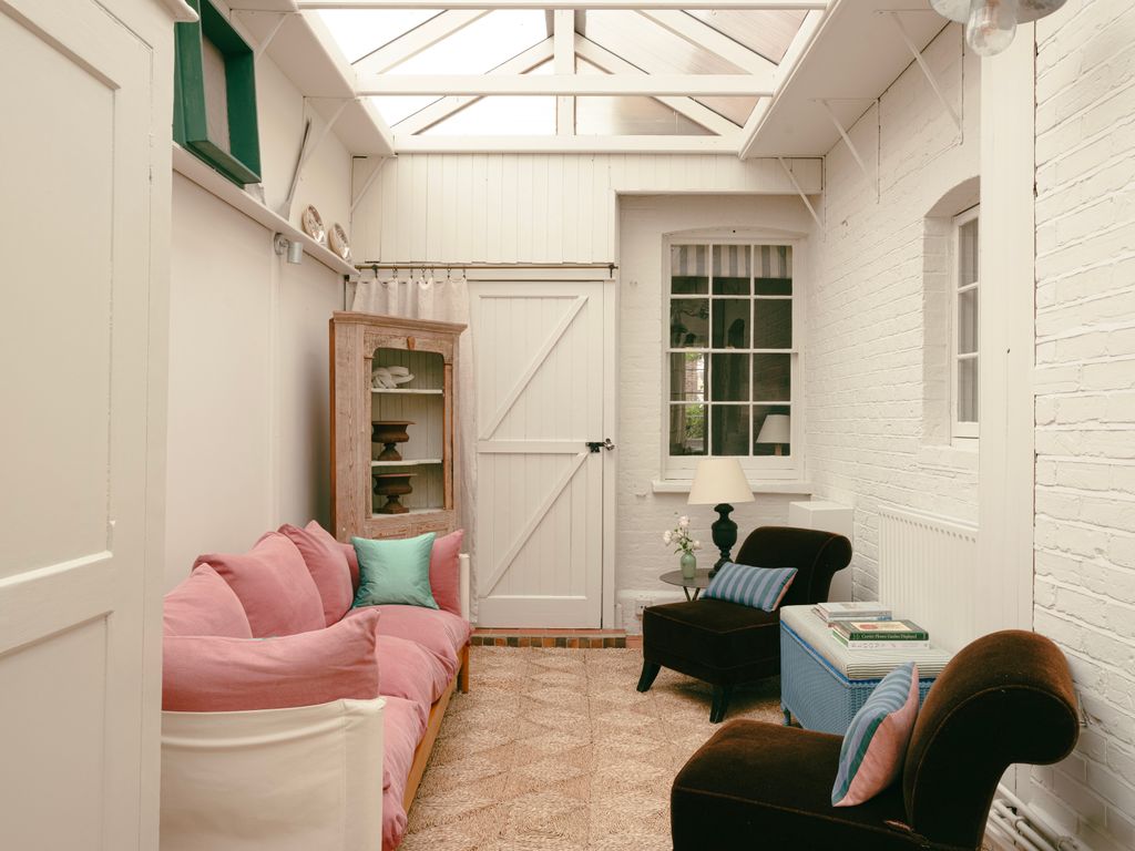 Image may contain Lamp Architecture Building Furniture Indoors Living Room Room Interior Design and Couch