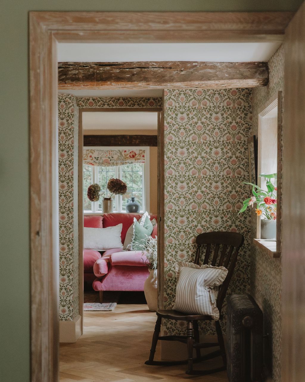 Image may contain Indoors Interior Design Chair Furniture Home Decor Rug Couch Dressing Room Room and Plant