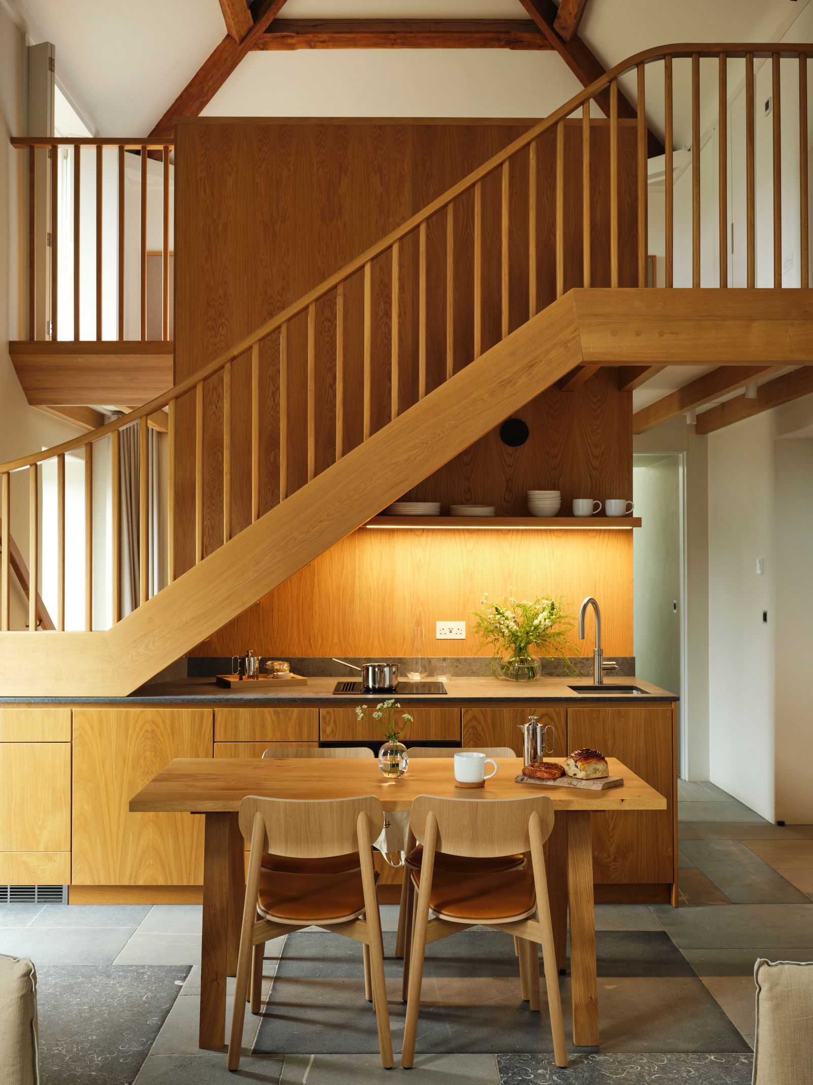 Image may contain Indoors Interior Design Architecture Building House Housing Staircase Wood Cup and Chair
