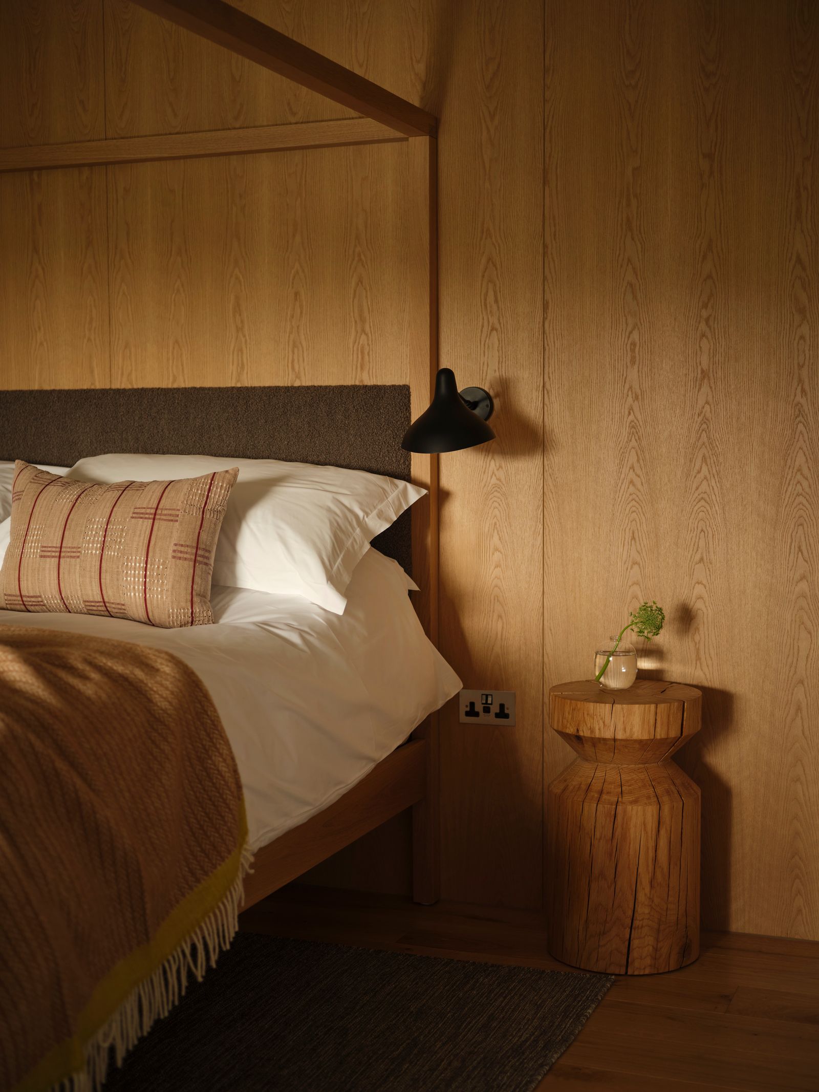 Image may contain Indoors Interior Design Wood Plywood Plant Bed Furniture Hardwood Home Decor Rug and Wood Panels