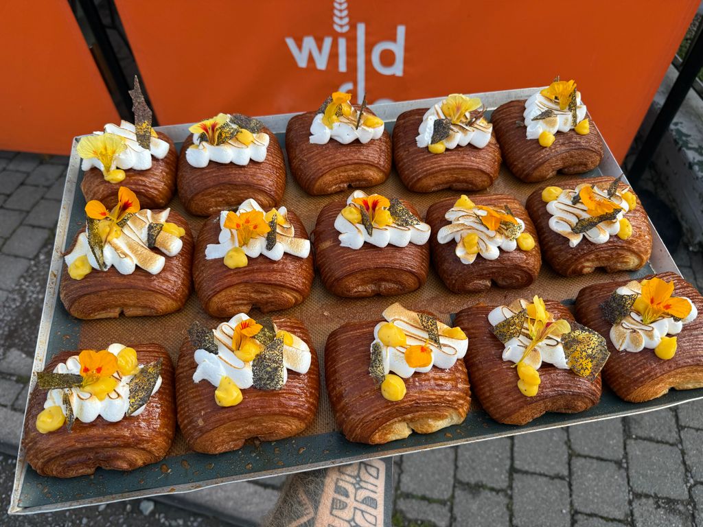 Image may contain Food Food Presentation Dessert Pastry Brunch Bread Shop Desk Furniture and Table