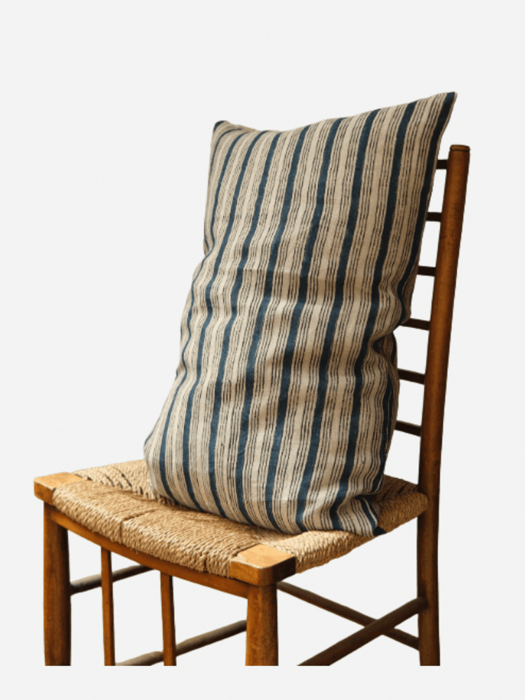 Image may contain: Cushion, Home Decor, Chair, Furniture, and Pillow