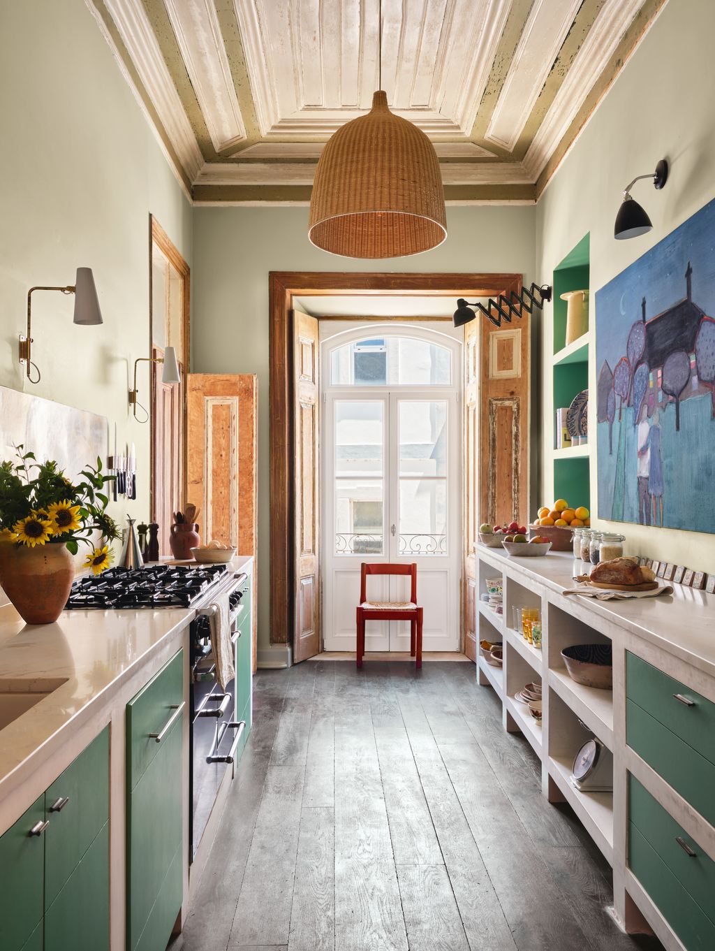 Image may contain Indoors Interior Design Lamp Floor Kitchen Chair Furniture Cooktop Bread Food Sink and Art