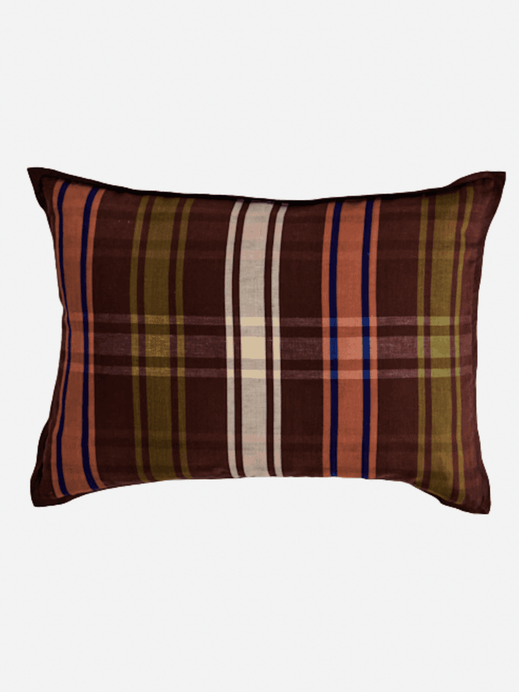 Image may contain: Cushion, Home Decor, Pillow, Clothing, and Shirt