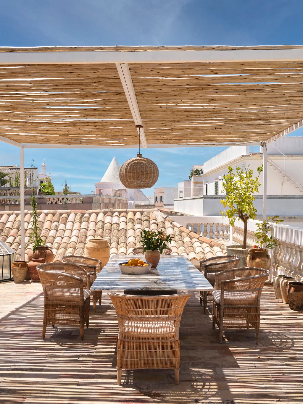 Image may contain Terrace Architecture Building Furniture Indoors Lounge Interior Design Chair and Plant