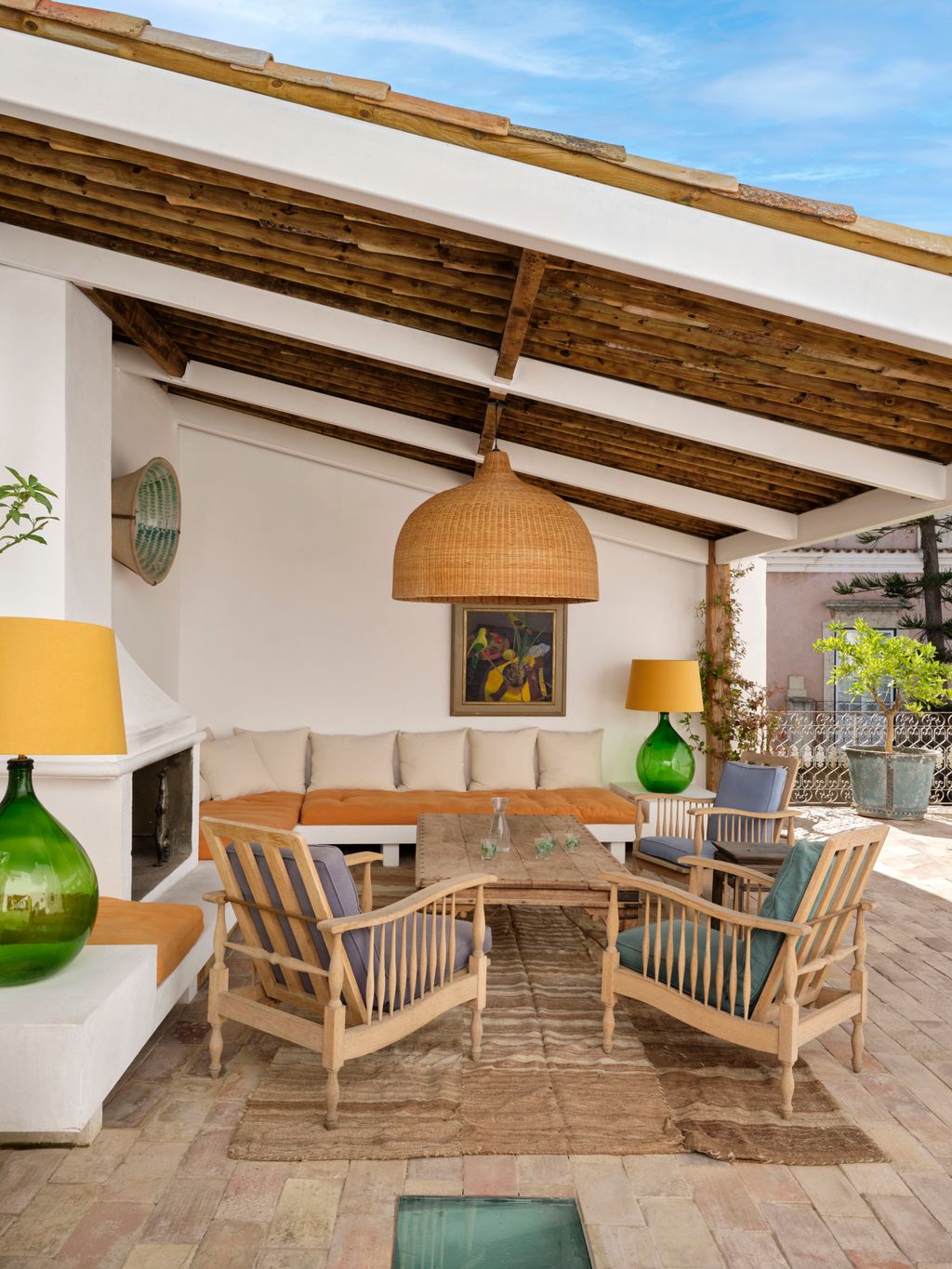 Image may contain Lamp Indoors Interior Design Chair Furniture Art Painting Home Decor Plant Table and Floor