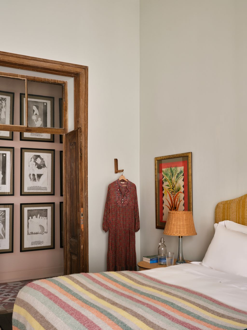 Image may contain Indoors Interior Design Lamp Cup Table Lamp Bed Furniture Art Painting Corner Bedroom and Room