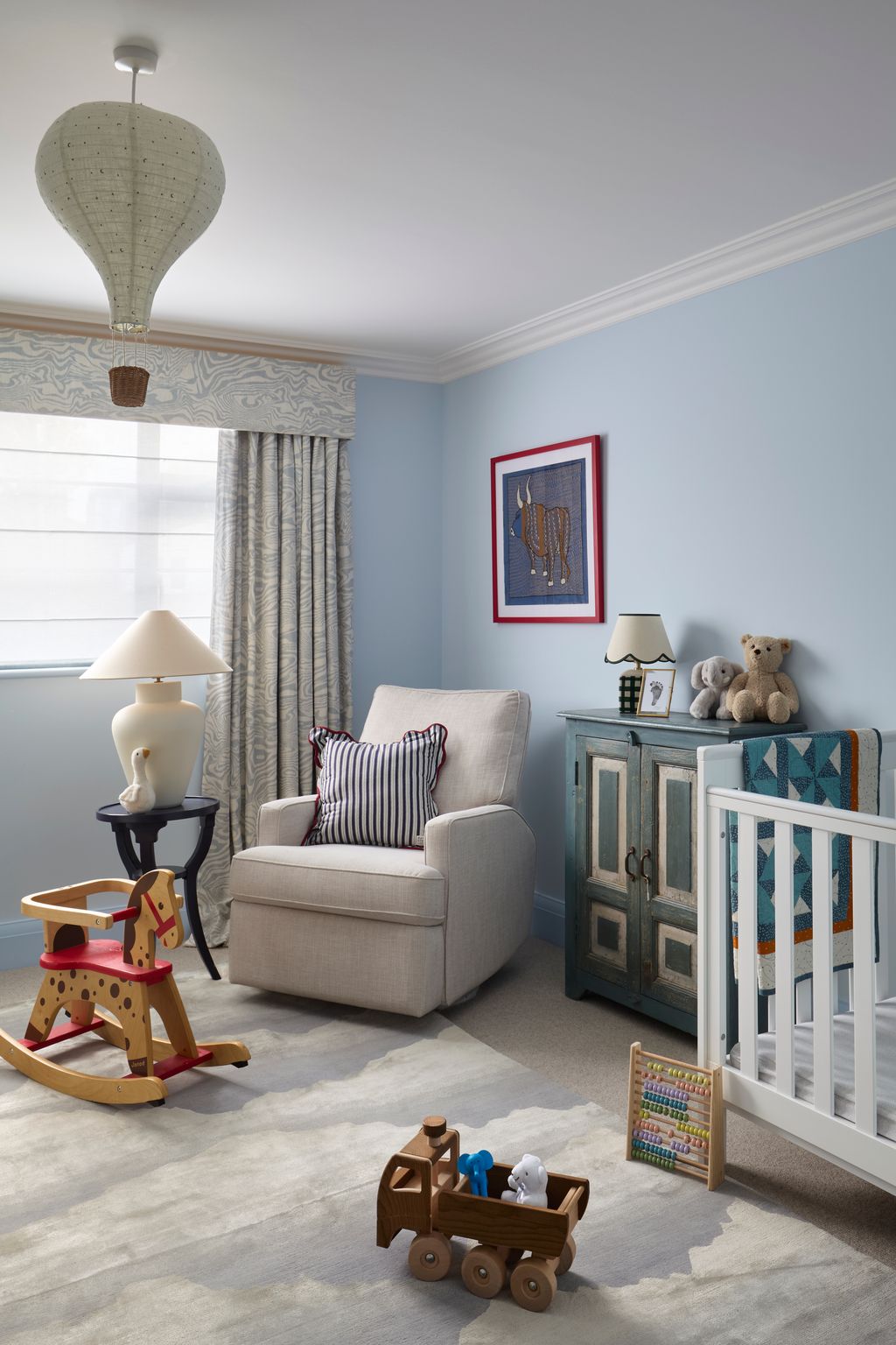 Image may contain Lamp Toy Indoors Nursery Room Art Painting Bed Furniture Home Decor Couch Crib and Infant Bed