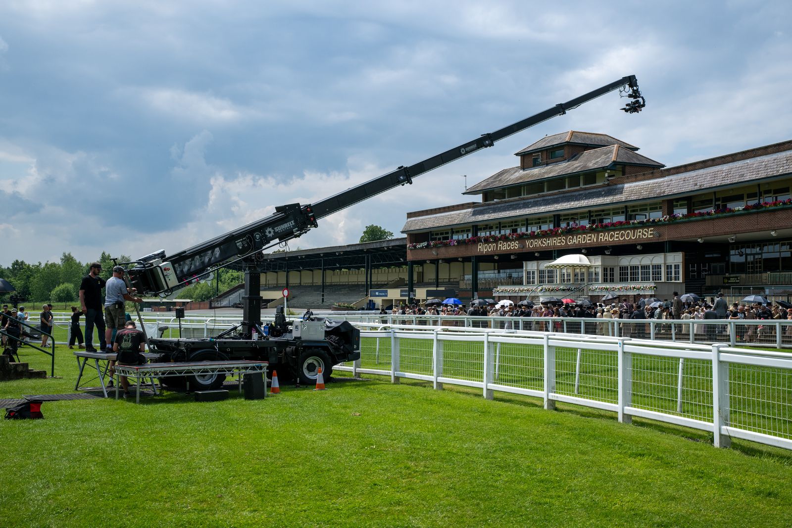 Image may contain Person Grass Plant Weapon Artillery Accessories Bag and Handbag