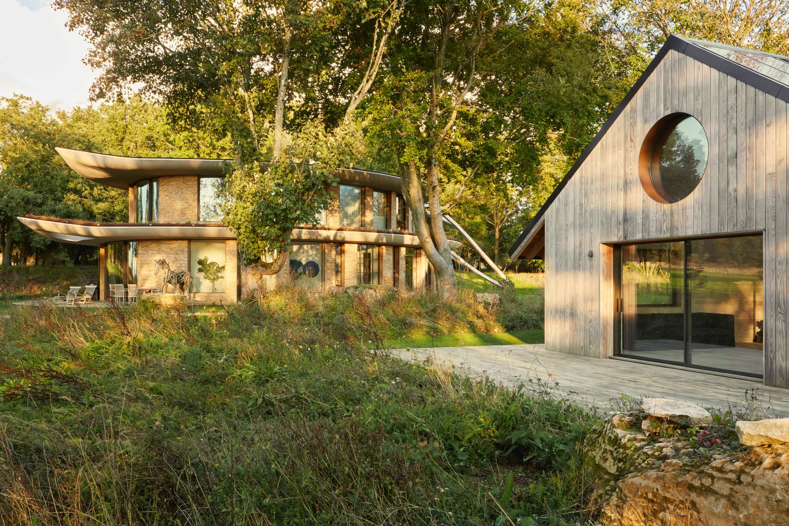 Image may contain Architecture Building Cottage House Housing Outdoors Shelter Grass Plant and Indoors