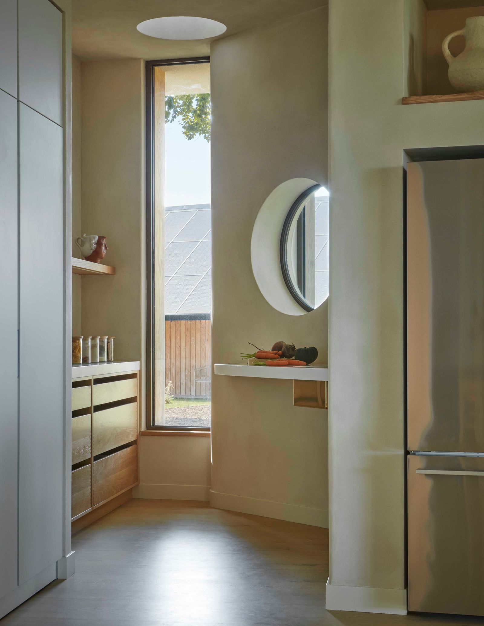 Image may contain Indoors Interior Design Floor Window Appliance Device Electrical Device Refrigerator and Cup