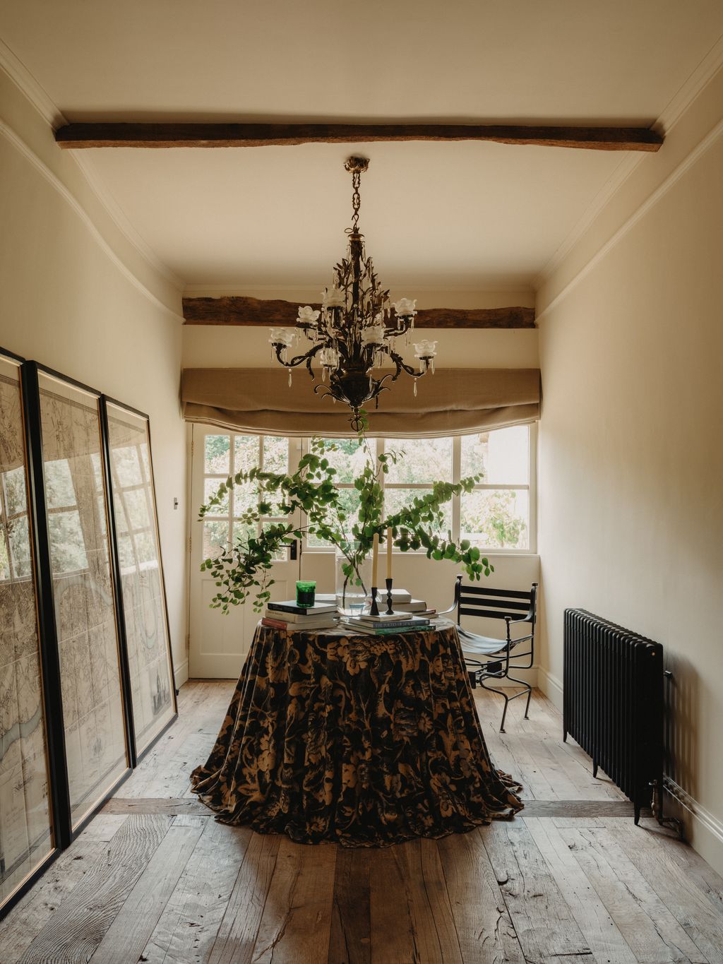 In the entrance hall of this Cotswold barn decorated by motherdaughterrun design studio Berkeley Hawkes a clever roman...