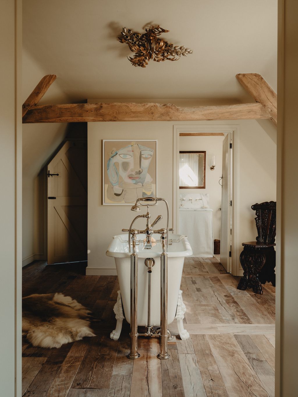The bath is a French antique sourced and restored by Antique France Design with taps by Barber Wilsons in polished...