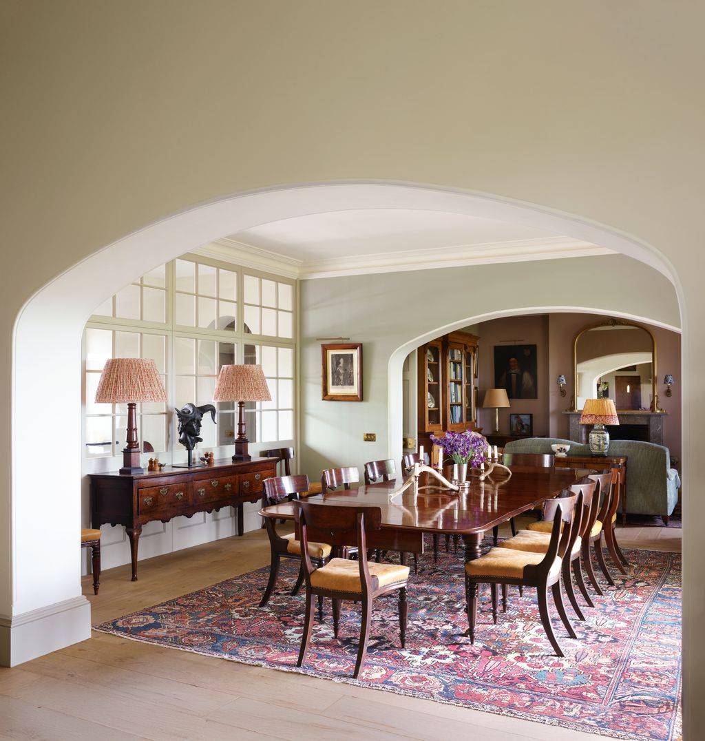 A George IV mahogany table and leatherupholstered Gillows dining chairs all from the Wormington Grange sale stand on an...