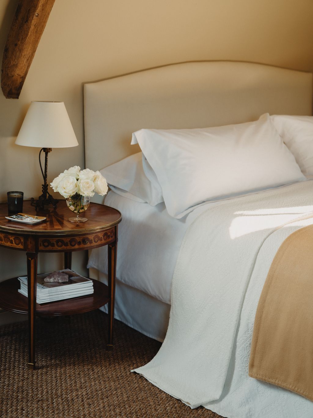 1950s Spanish occasional tables by Hermanos Garcia from Brownrigg stand on either side of the bed with c.1880 gilt...