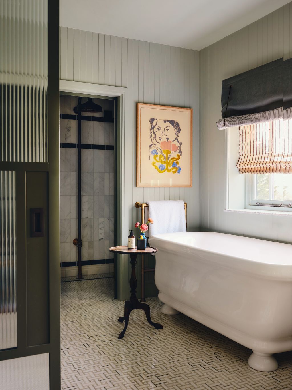 In the main bathroom ‘North Haven Basketweave floor tiles from Fired Earth and panelling painted in Pure  Originals...