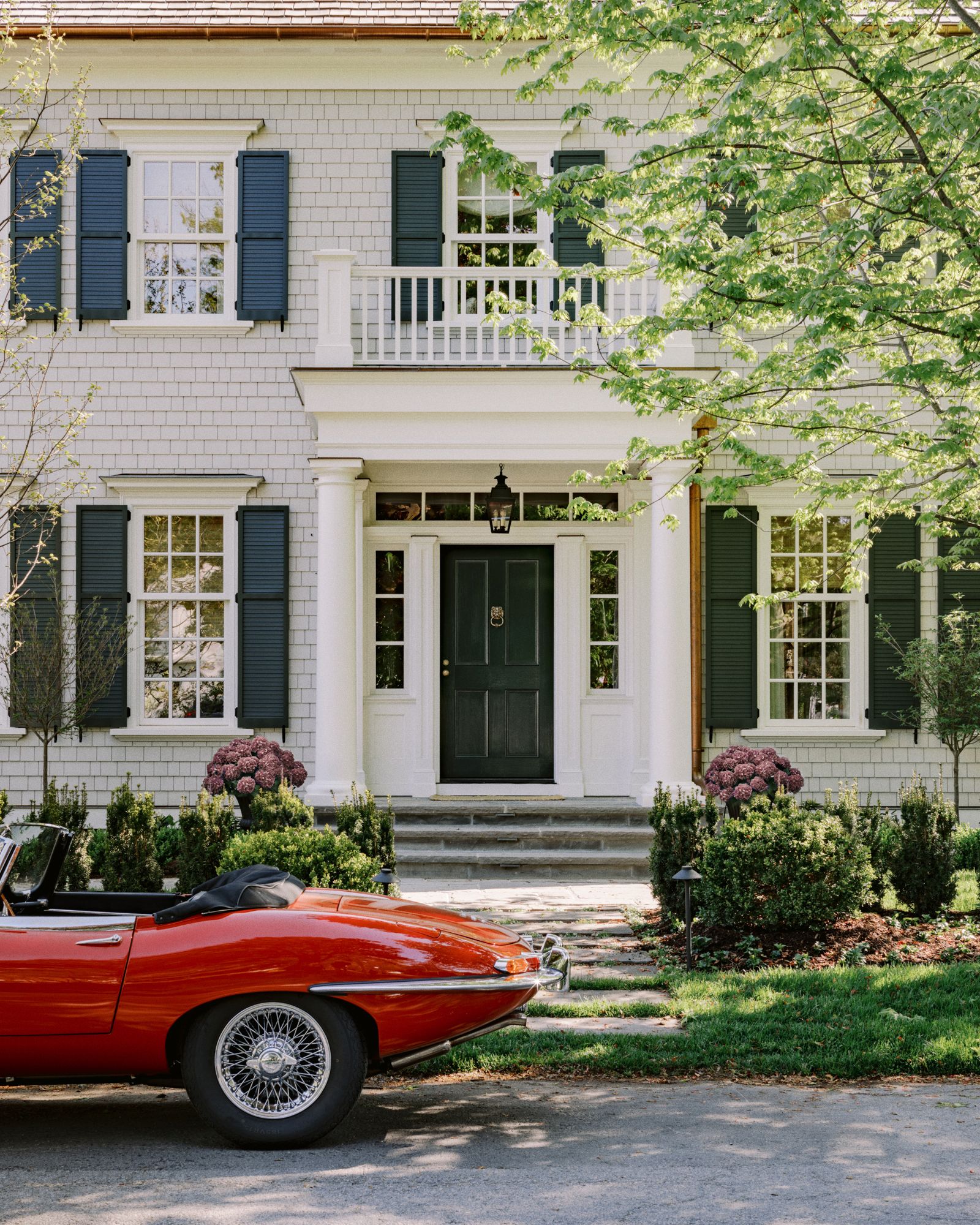 A ‘Hanging Kensington light fixture evoking the gas lamps of the 19th century welcomes visitors through the...