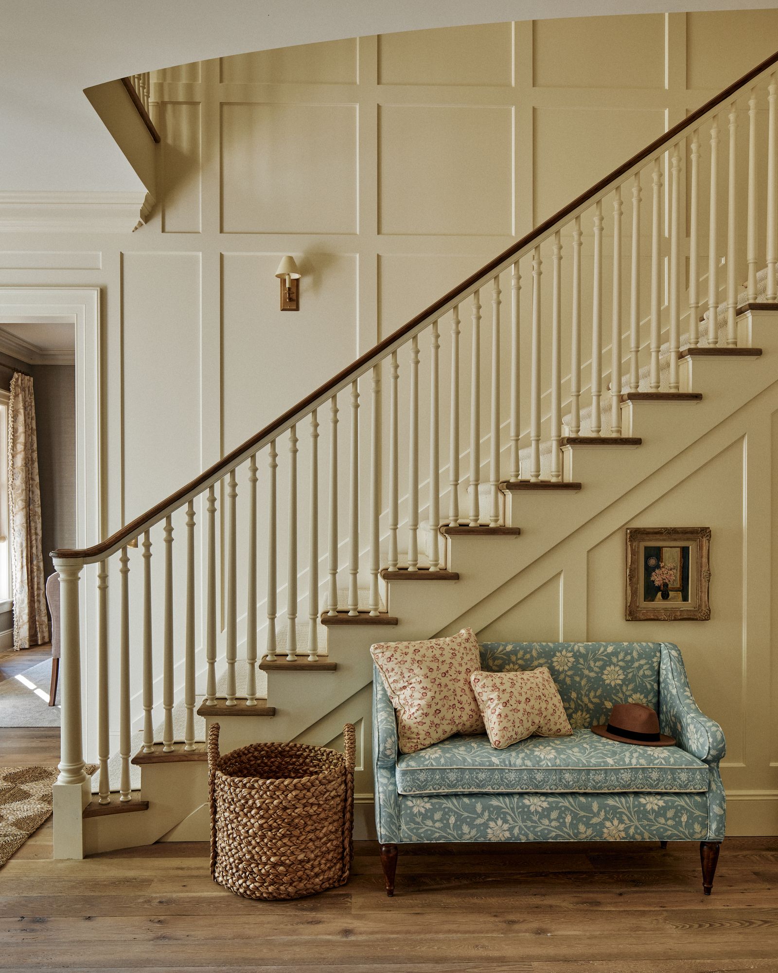 Simple square and rectangular panelling adds visual interest to these hallway walls painted in the designers custom...