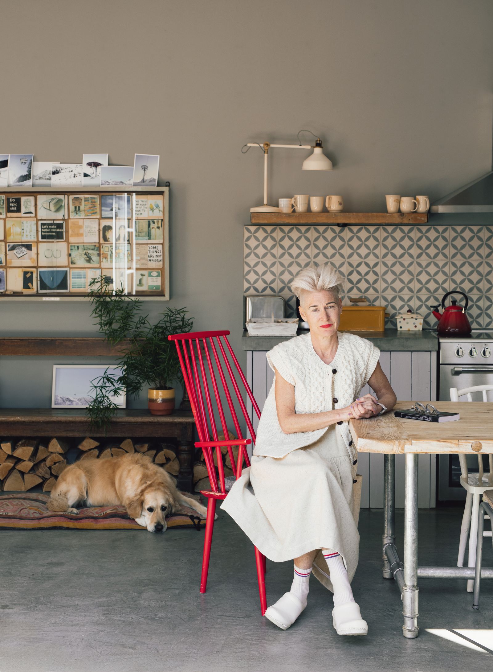 Aoibheann with golden retriever Puffy in the kitchen and dining area of her openplan home she is sitting on Hays...