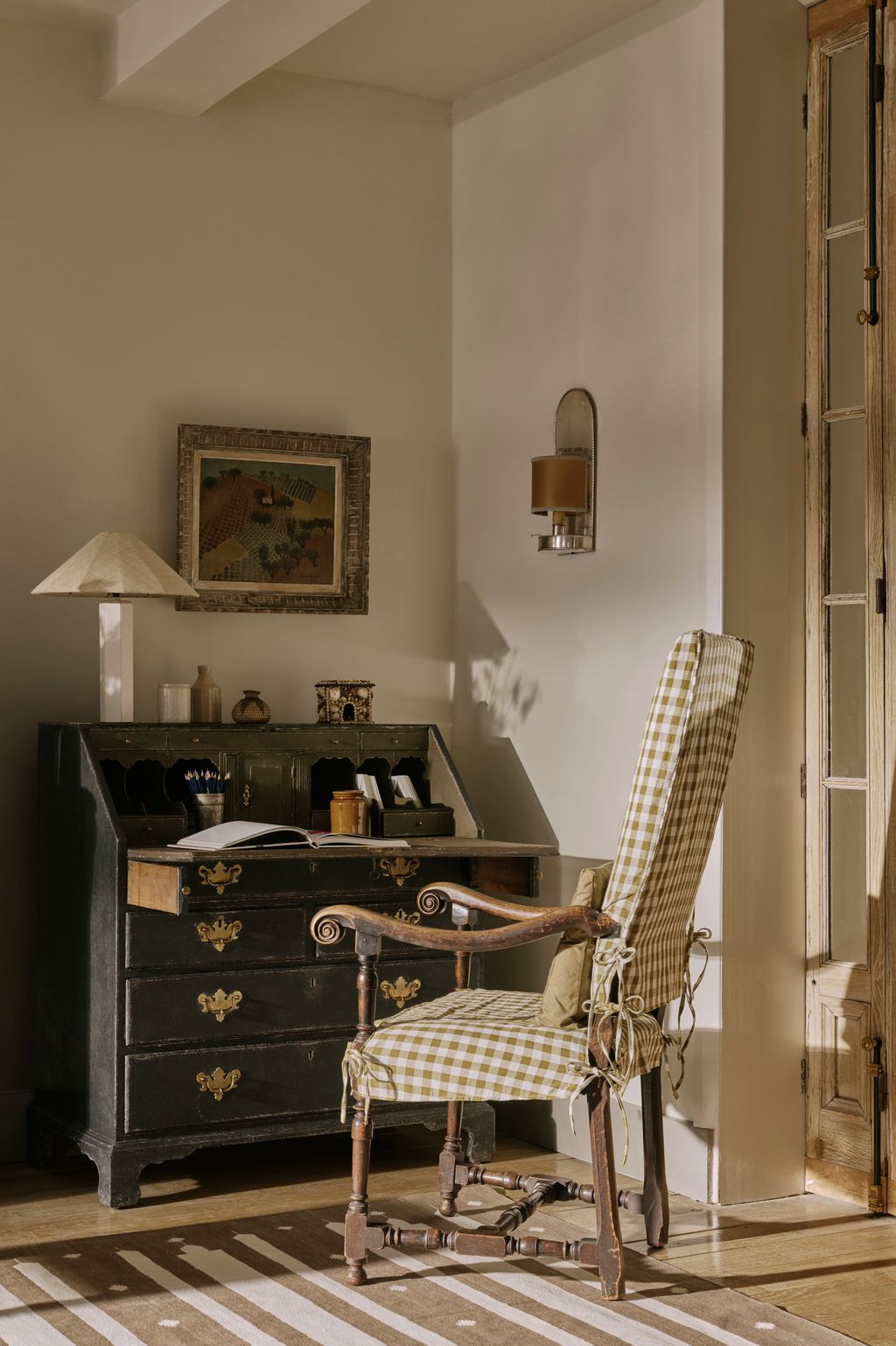 The French landscape painting was bought from Collins and Green. The lamp is Pinch.