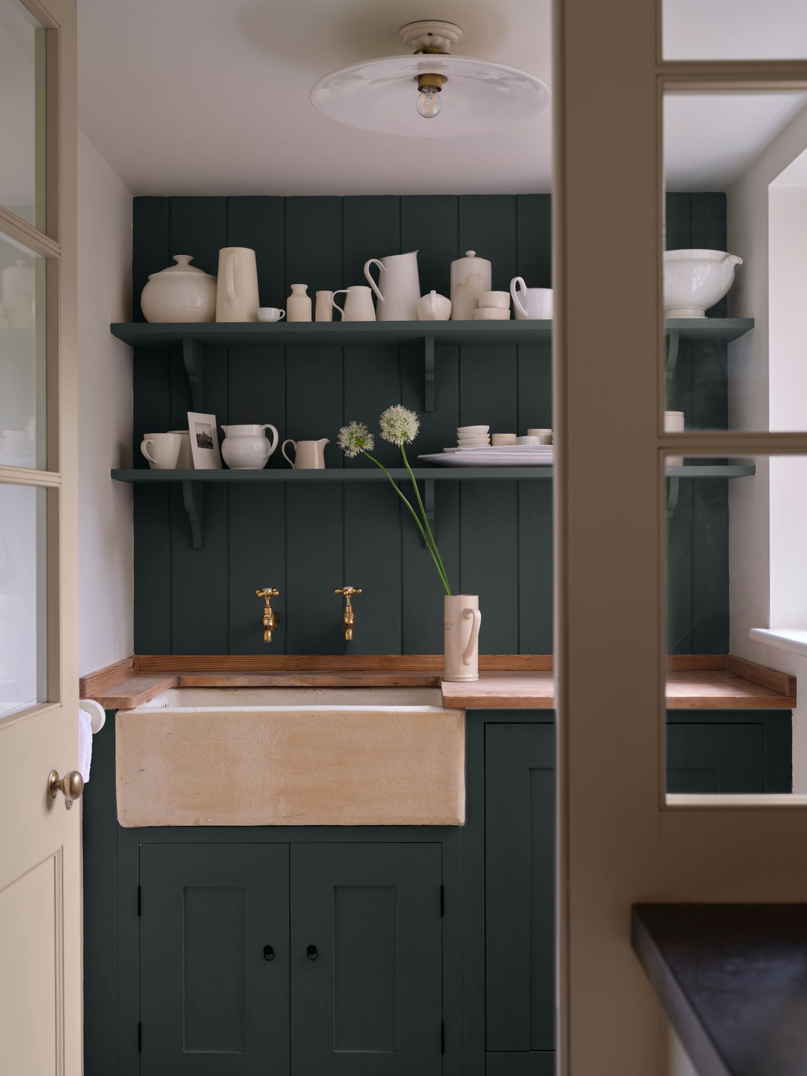 Cabinetry and panelling in ‘Douter and the door in ‘Scallop both in Flat Eggshell are combined with walls in ‘Wimborne...