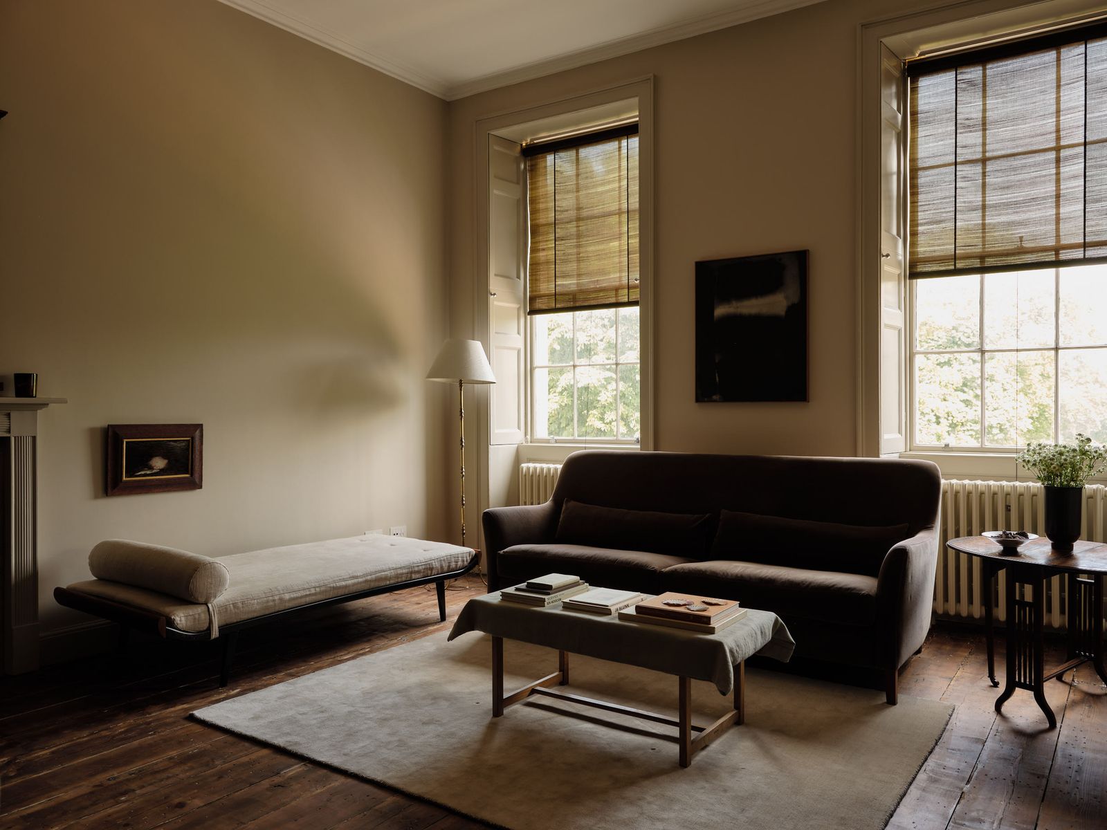 The living room decoration is deliberately spare yet still warm. The sofa is from Pinch.