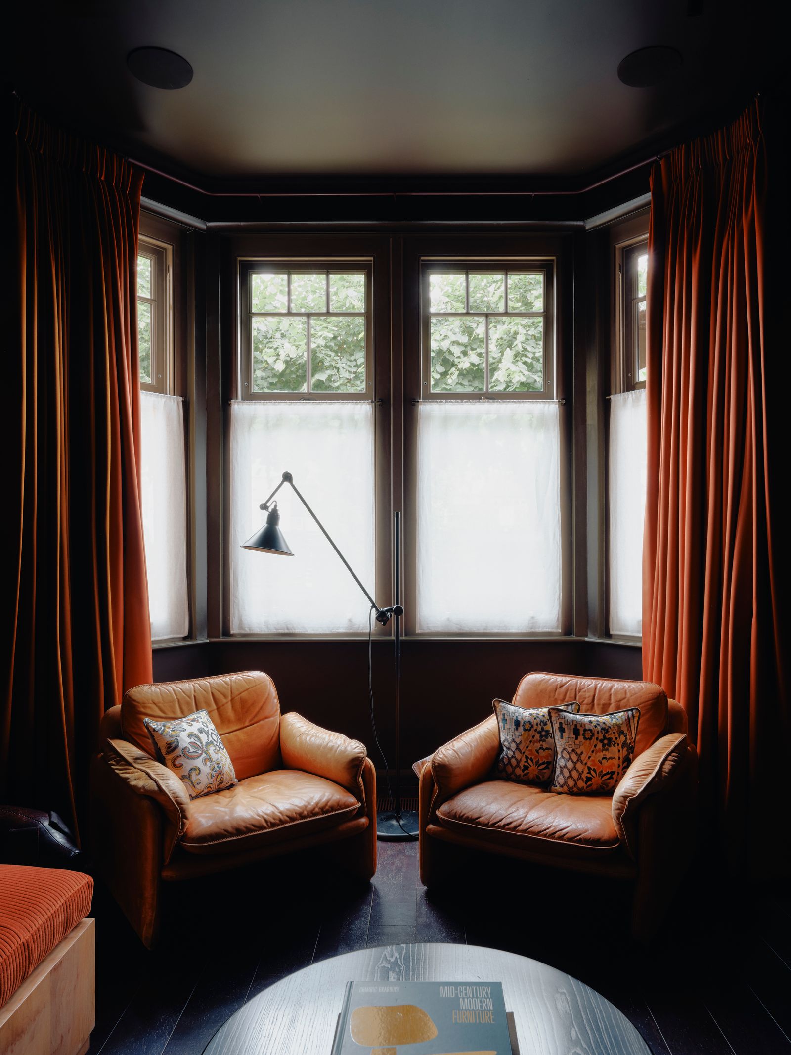 De Sede DS61 armchairs from ReHaus sit beside curtains made with two colourways of Town fabric from Mark Alexander...