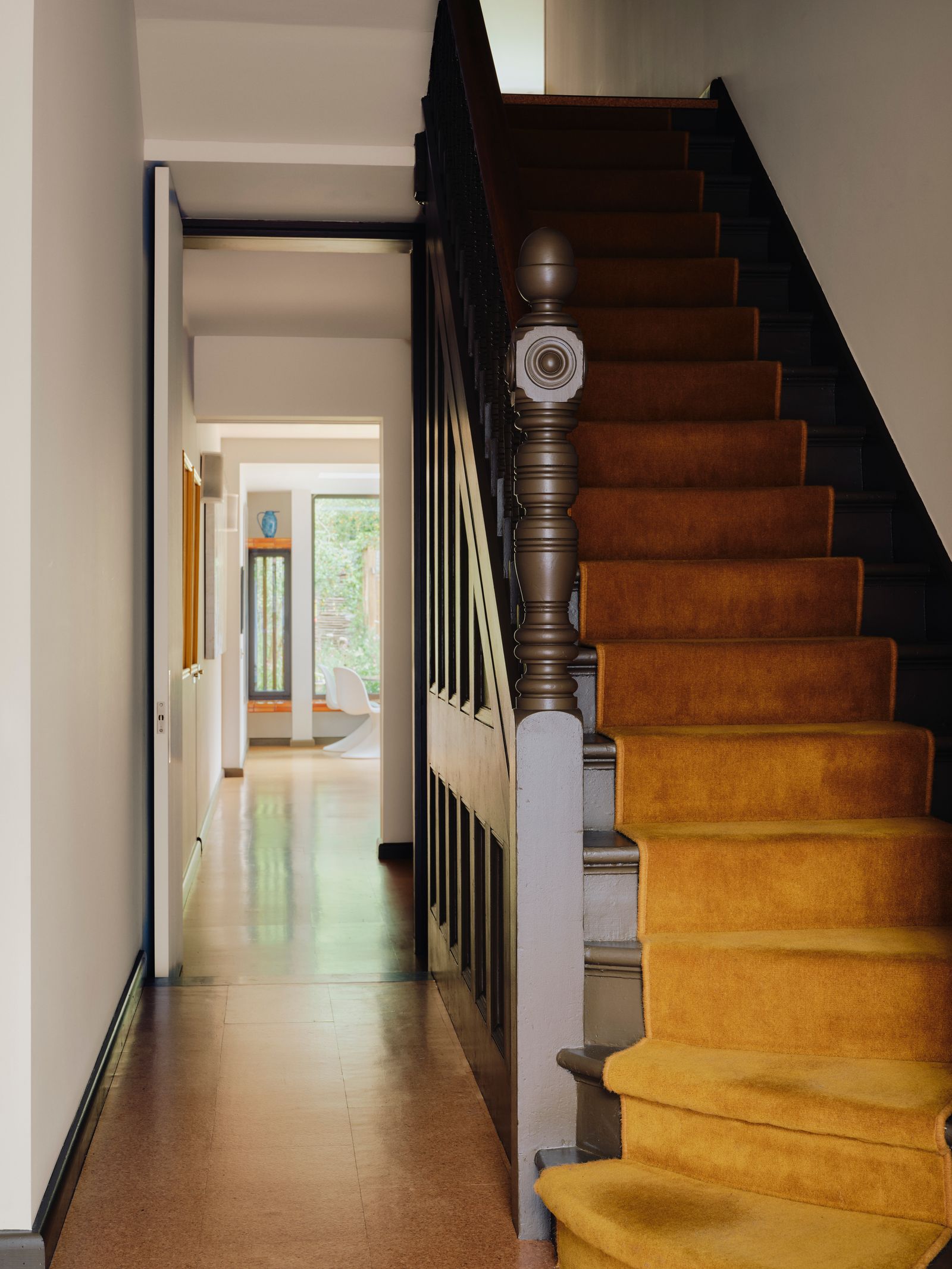 The houses original staircase is painted in ‘Bronze from Paint amp Paper Library with cork flooring from Granorte via...