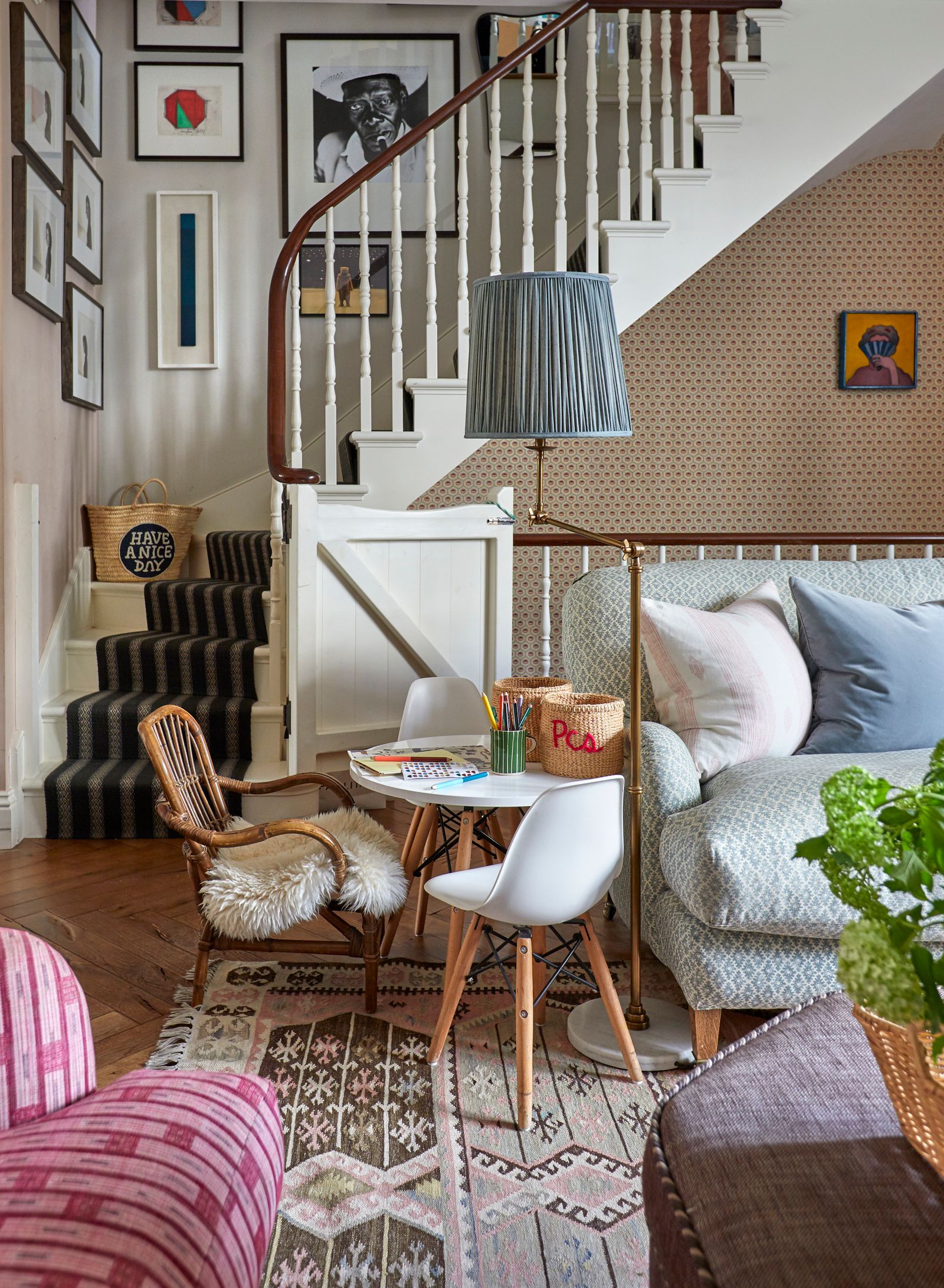 The stairs lead down to a relaxed sitting area at one end of the kitchen. It is furnished with a mix of highstreet and...