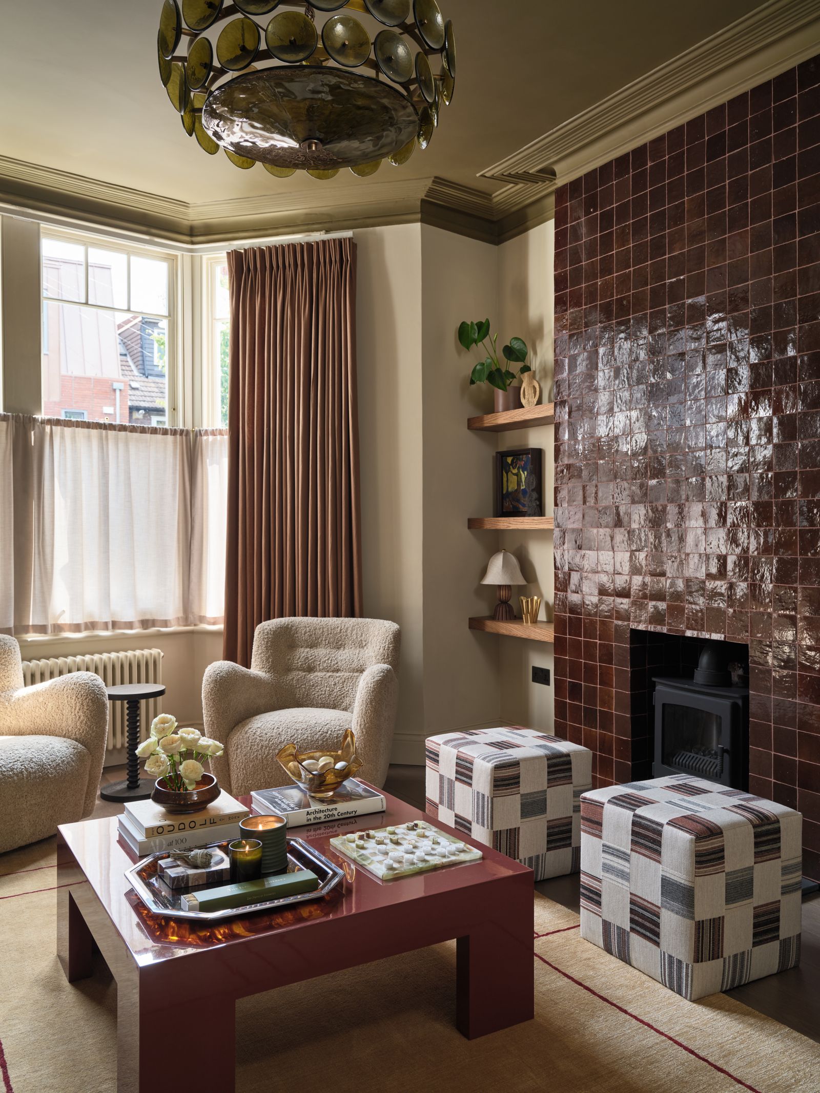 The red tiled fireplace echoes the colour of the coffee table.