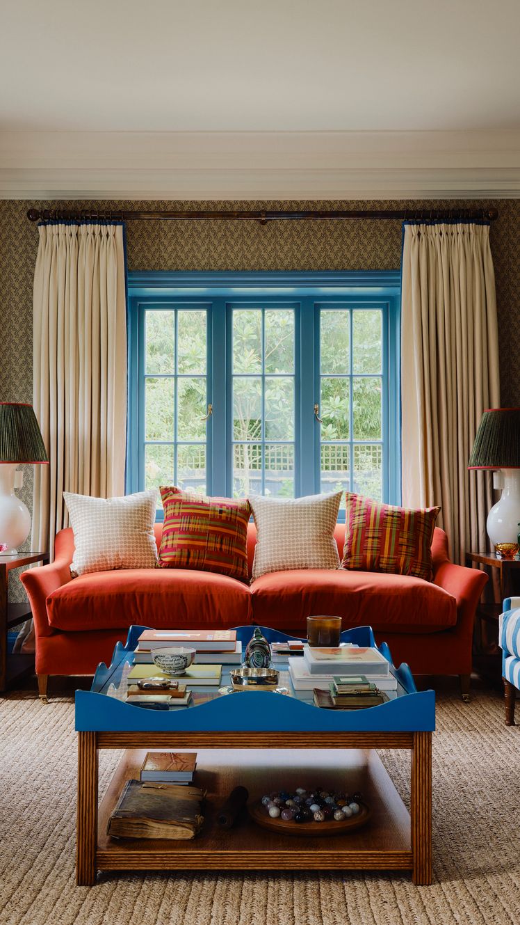 Bold colours and patterns come together in the drawing room with terracotta and green tones lifted by touches of cobalt...
