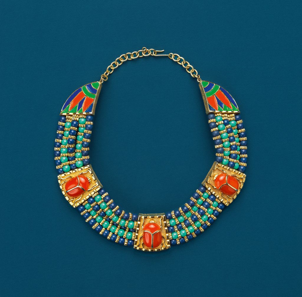 This Egyptian Revival scarab necklace by Hattie Carnegie made in 1972 combines lapis and turquoise beads with carnelians...