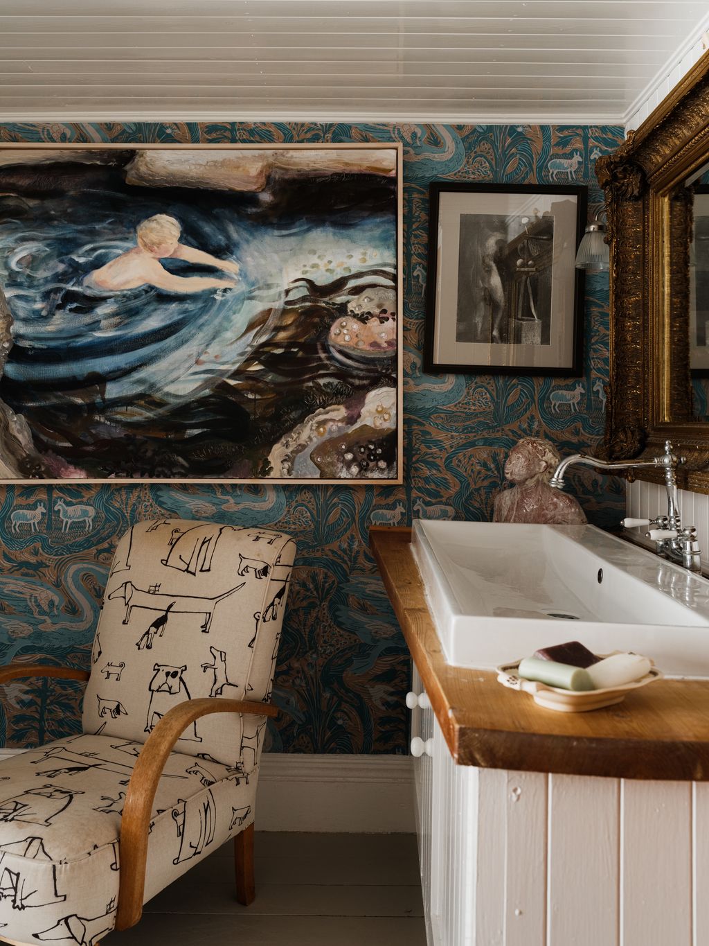 The Lshaped bathroom once used as the house's lumber room according to the deeds has a painting of a swimmer by Brita on...