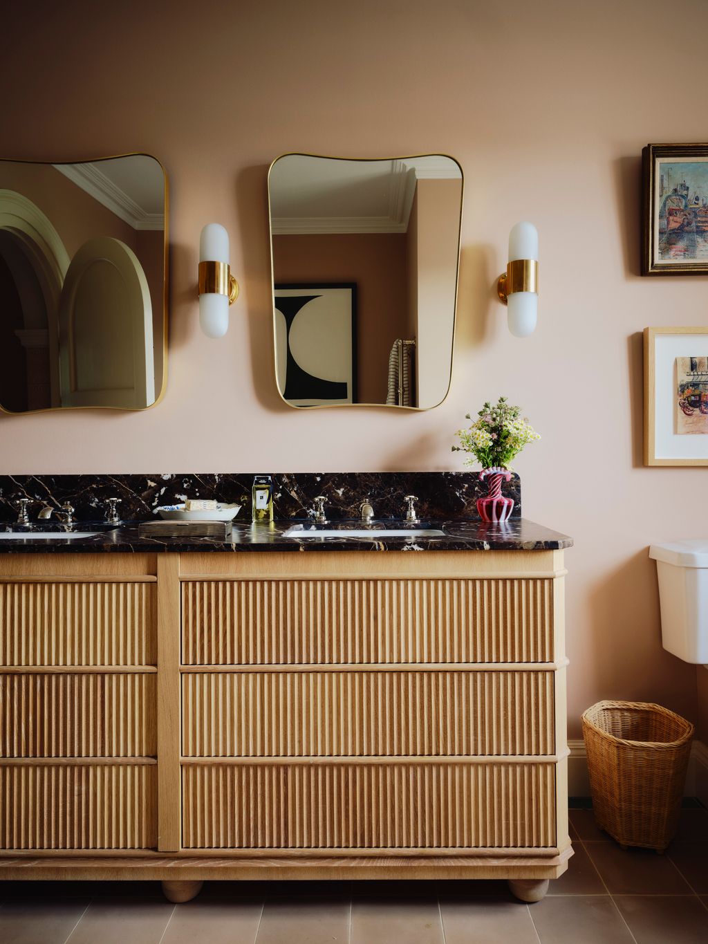 The vanity unit is a bespoke design and the lights are from Felix Lighting.