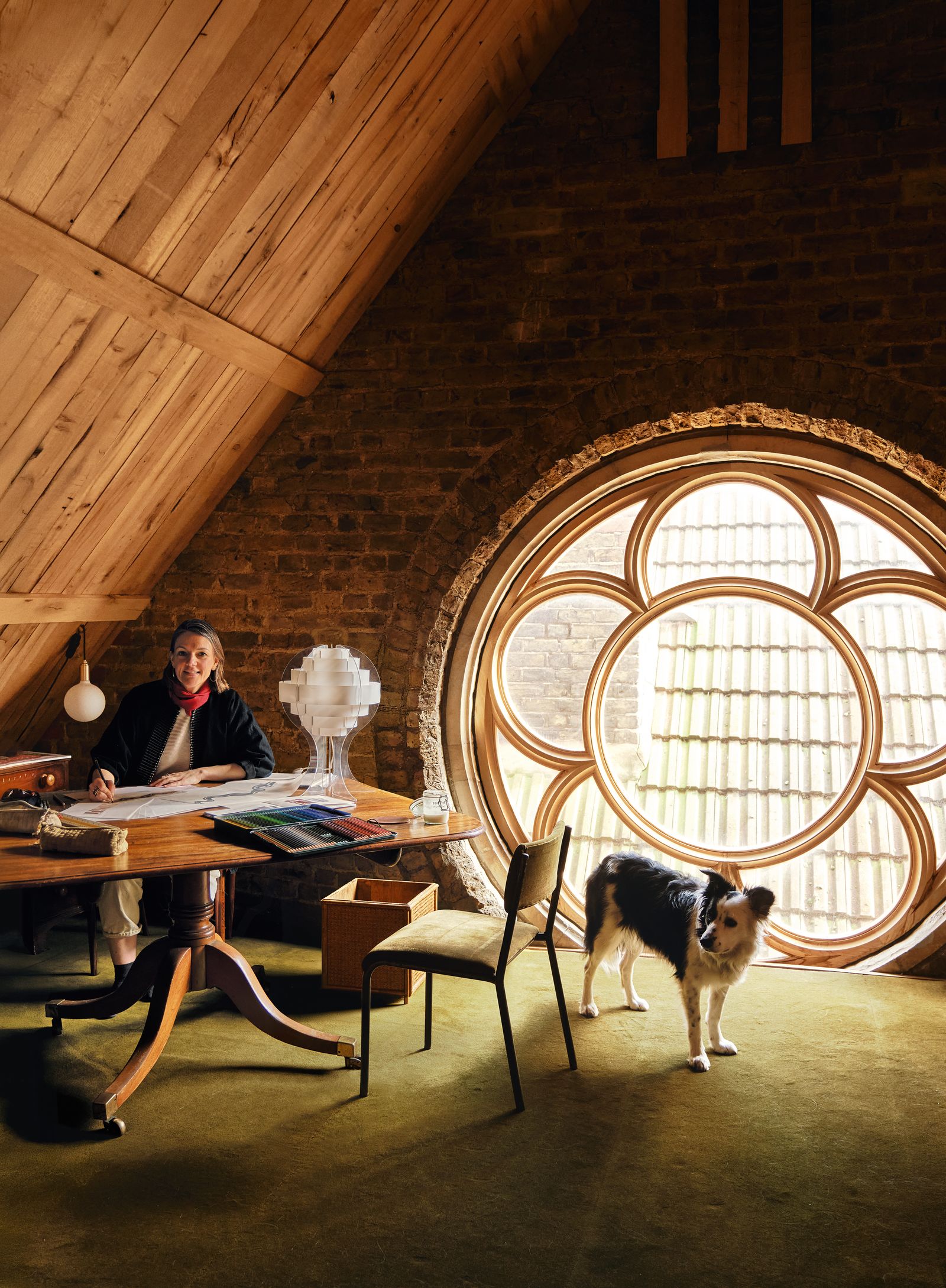 Architect James Stevens carved out space at the top of the building to establish a work area for Lucy. The huge rose...